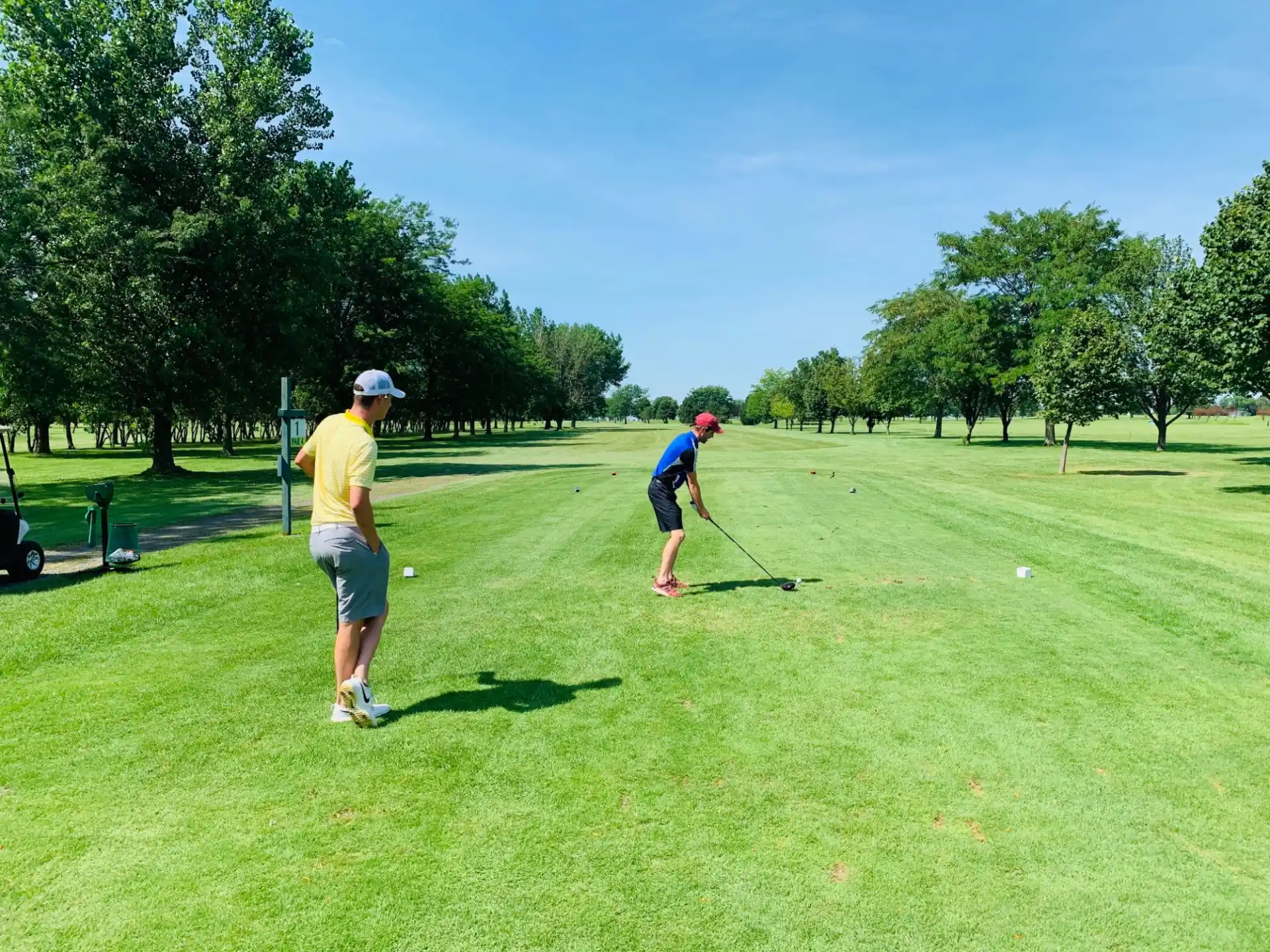 a couple of men playing golf