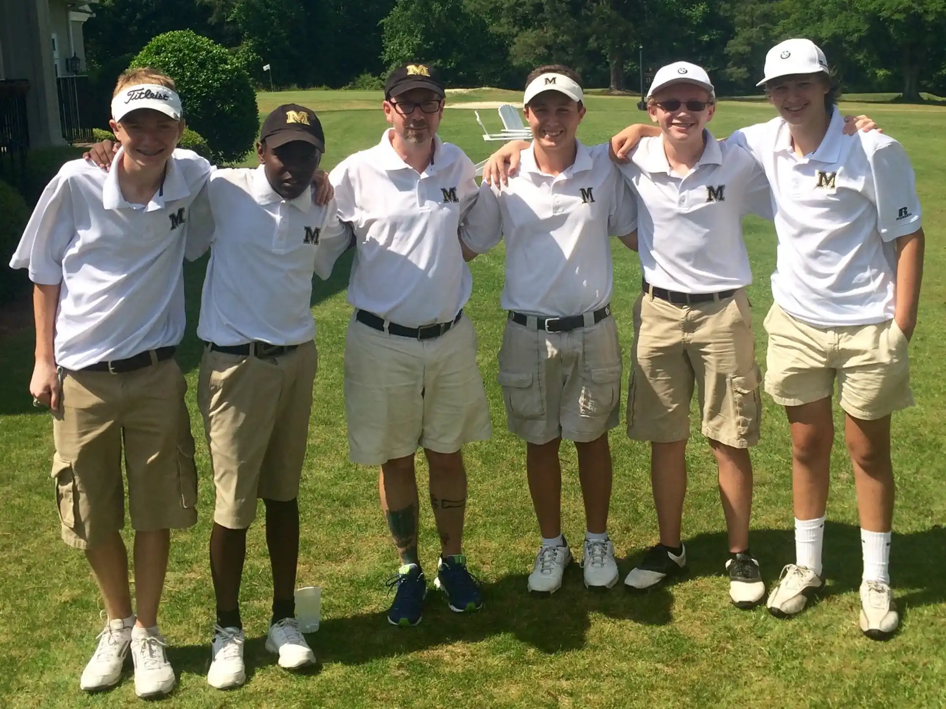 a group of men wearing white shirts