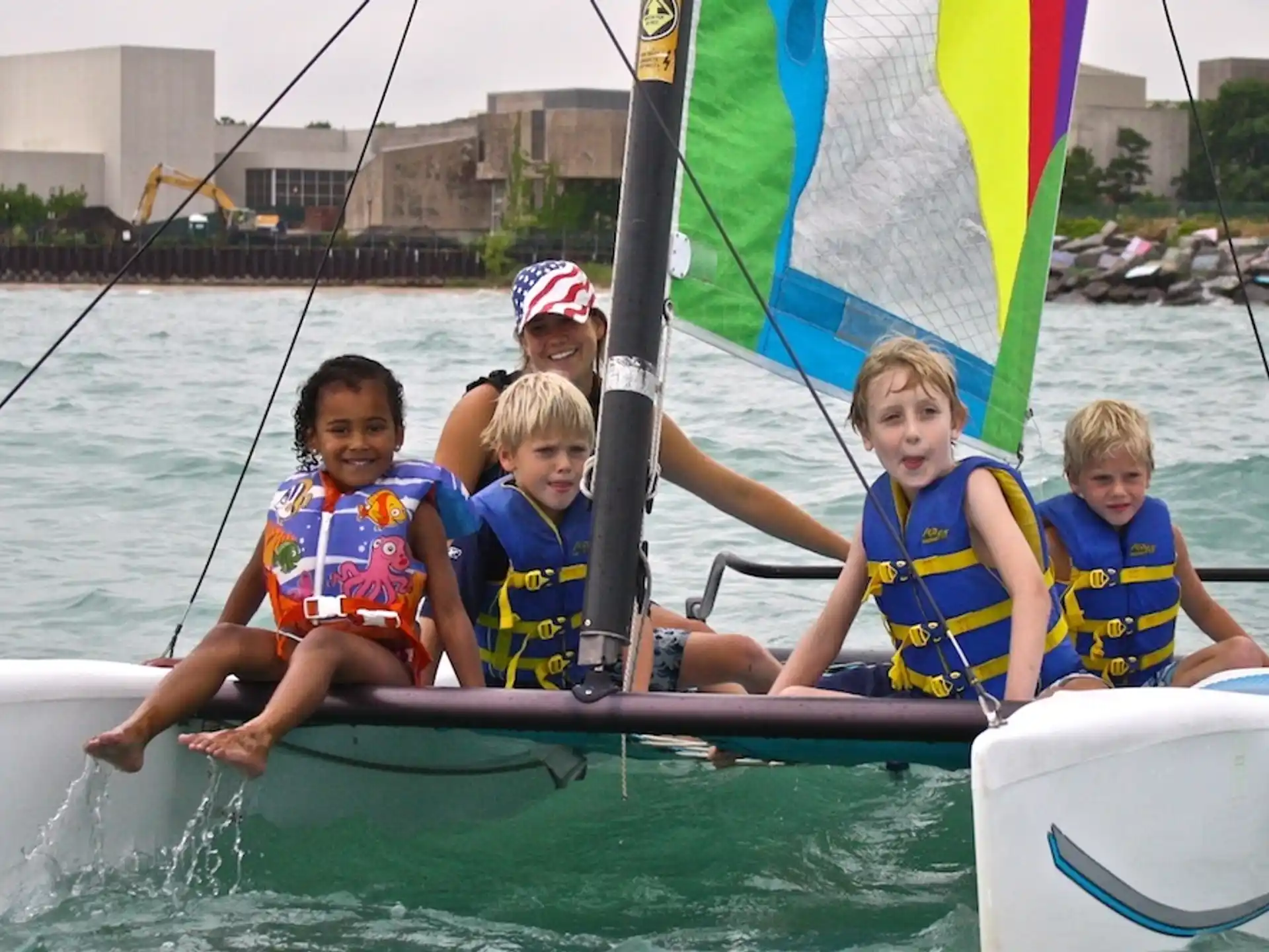 a group of kids in a boat