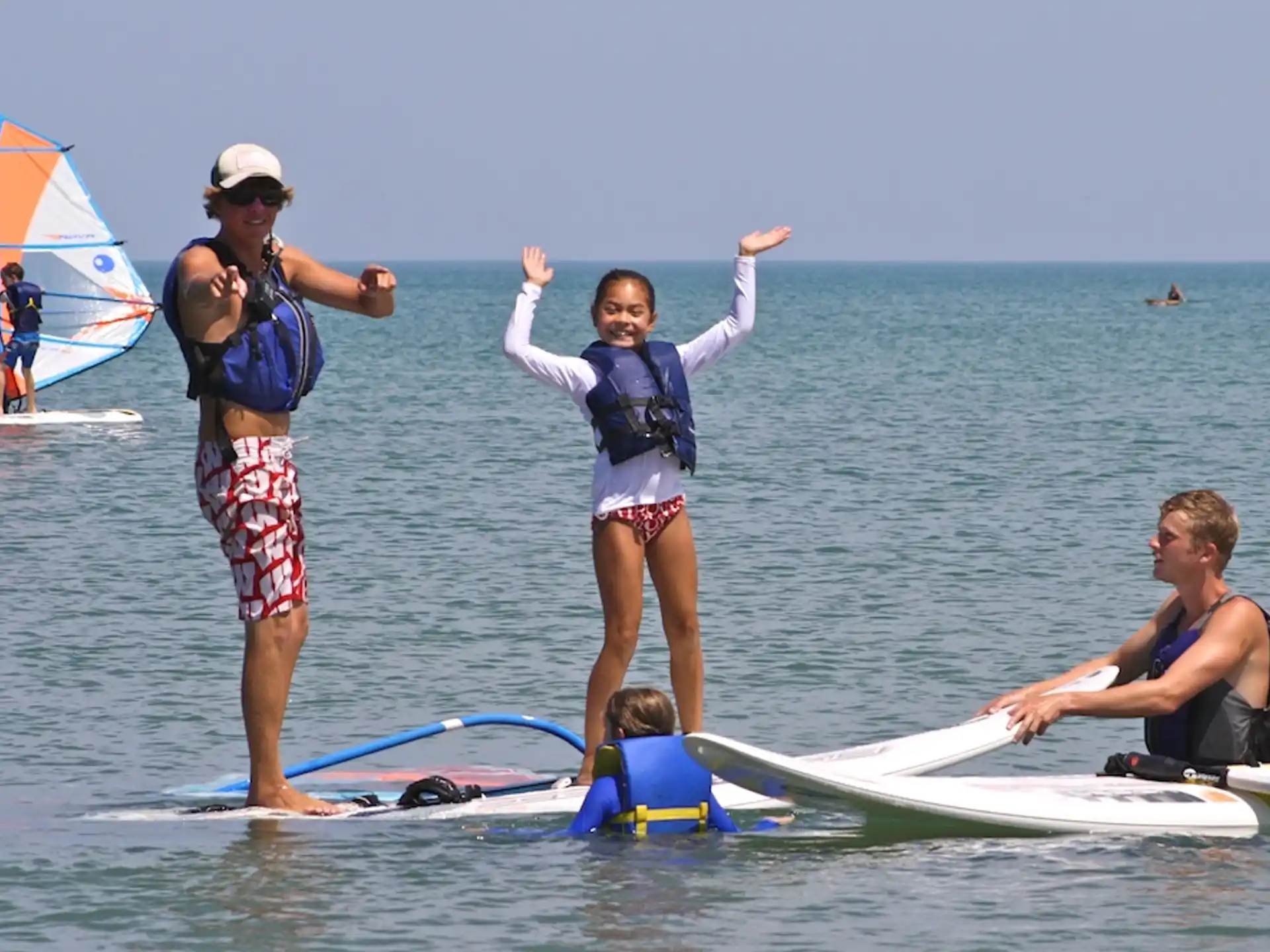 a group of people on surfboards