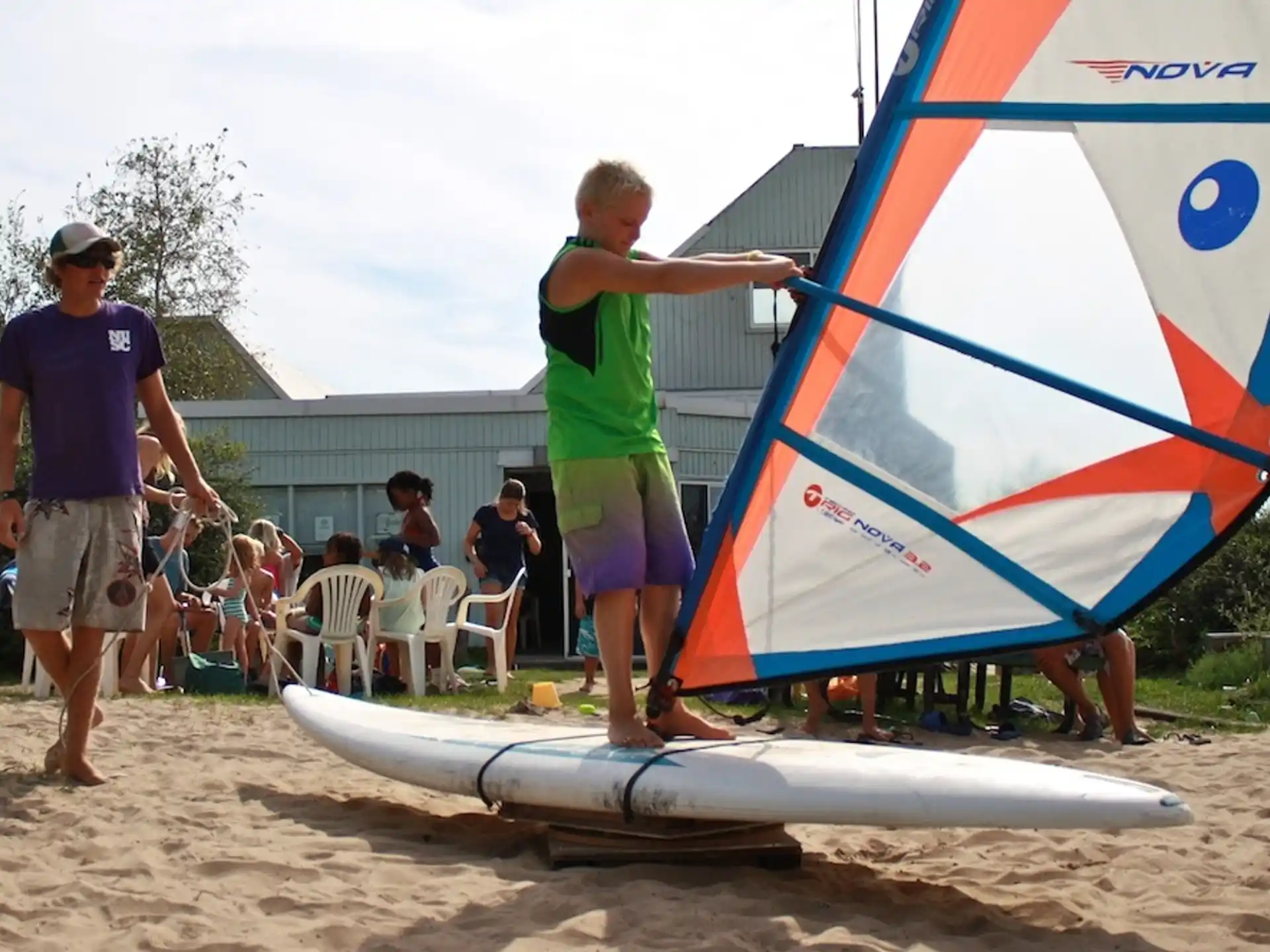 a person holding a sailboard