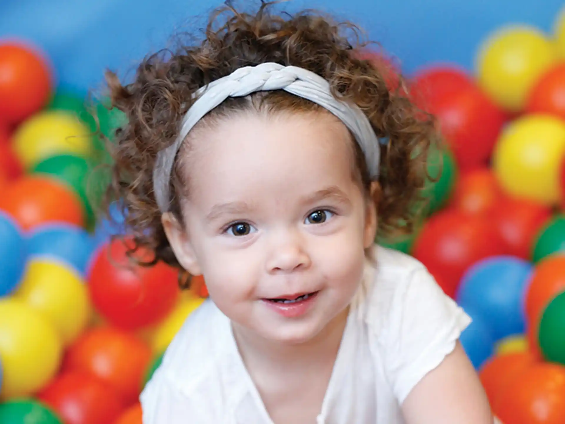 a child in a ball pit