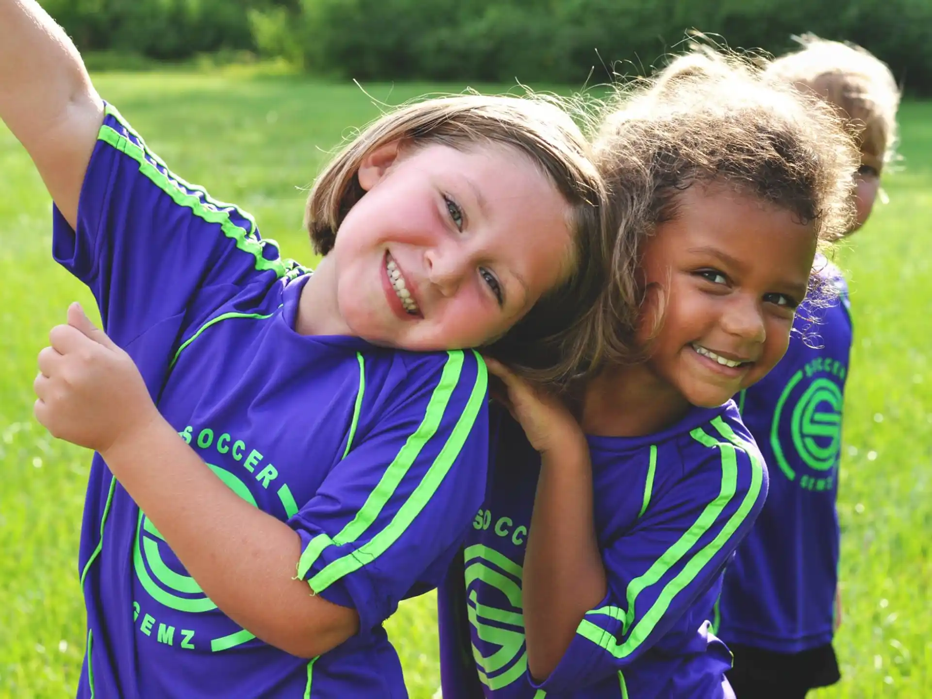 a couple of girls in sports uniforms