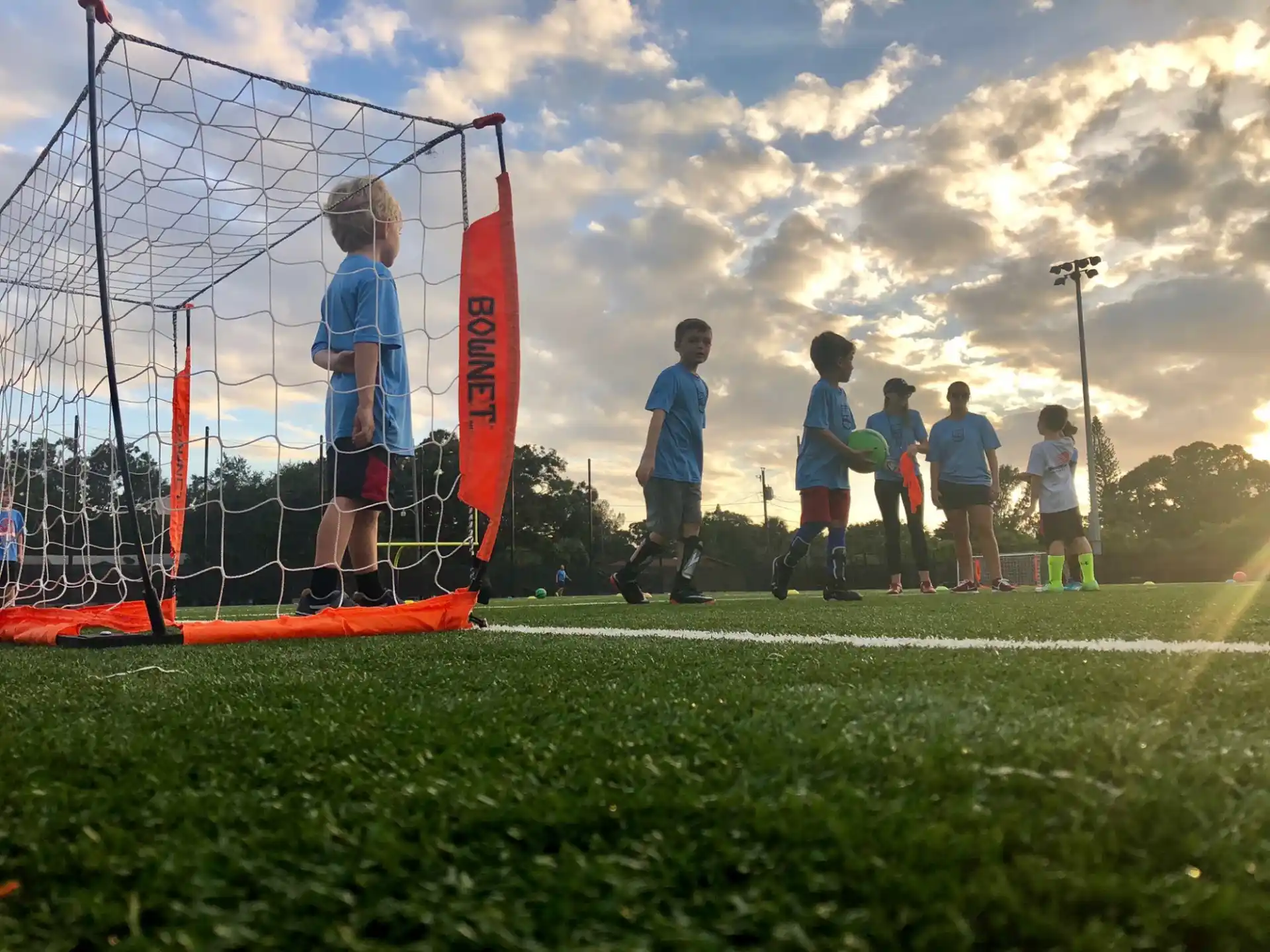 a group of kids playing football