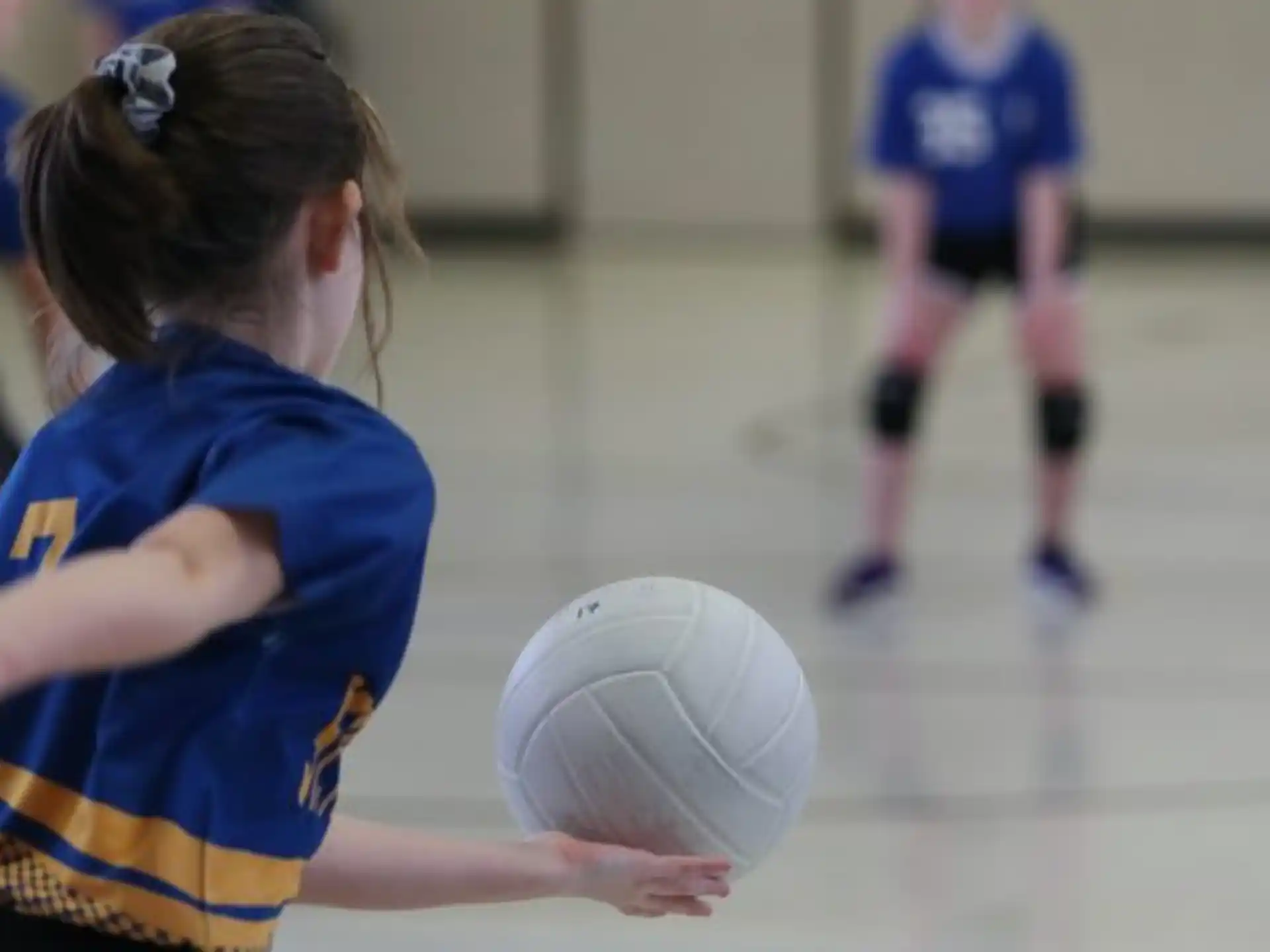 a girl playing volleyball