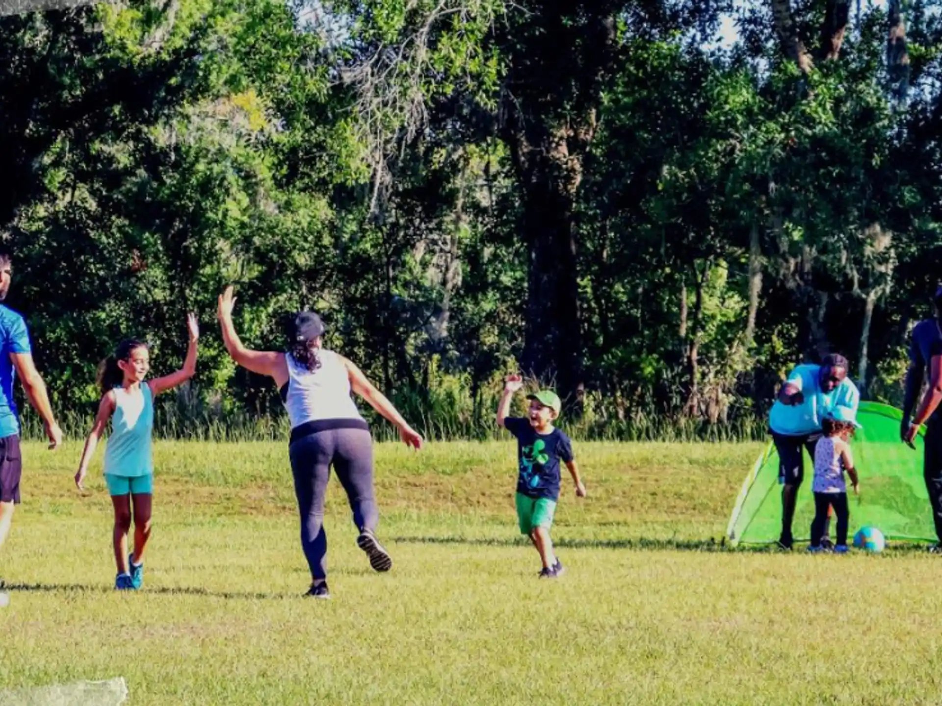 a group of people running on a field