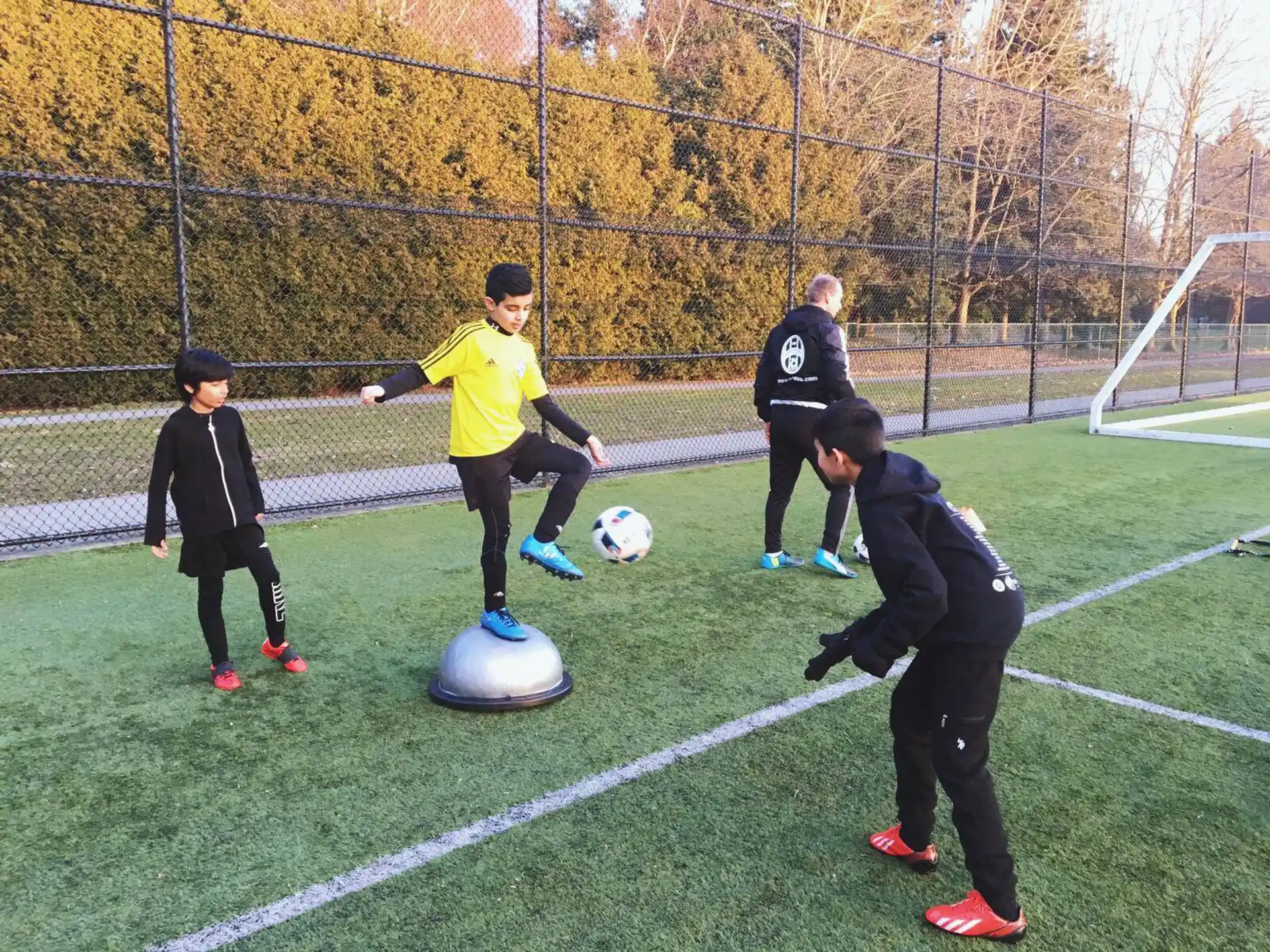 a group of kids playing football