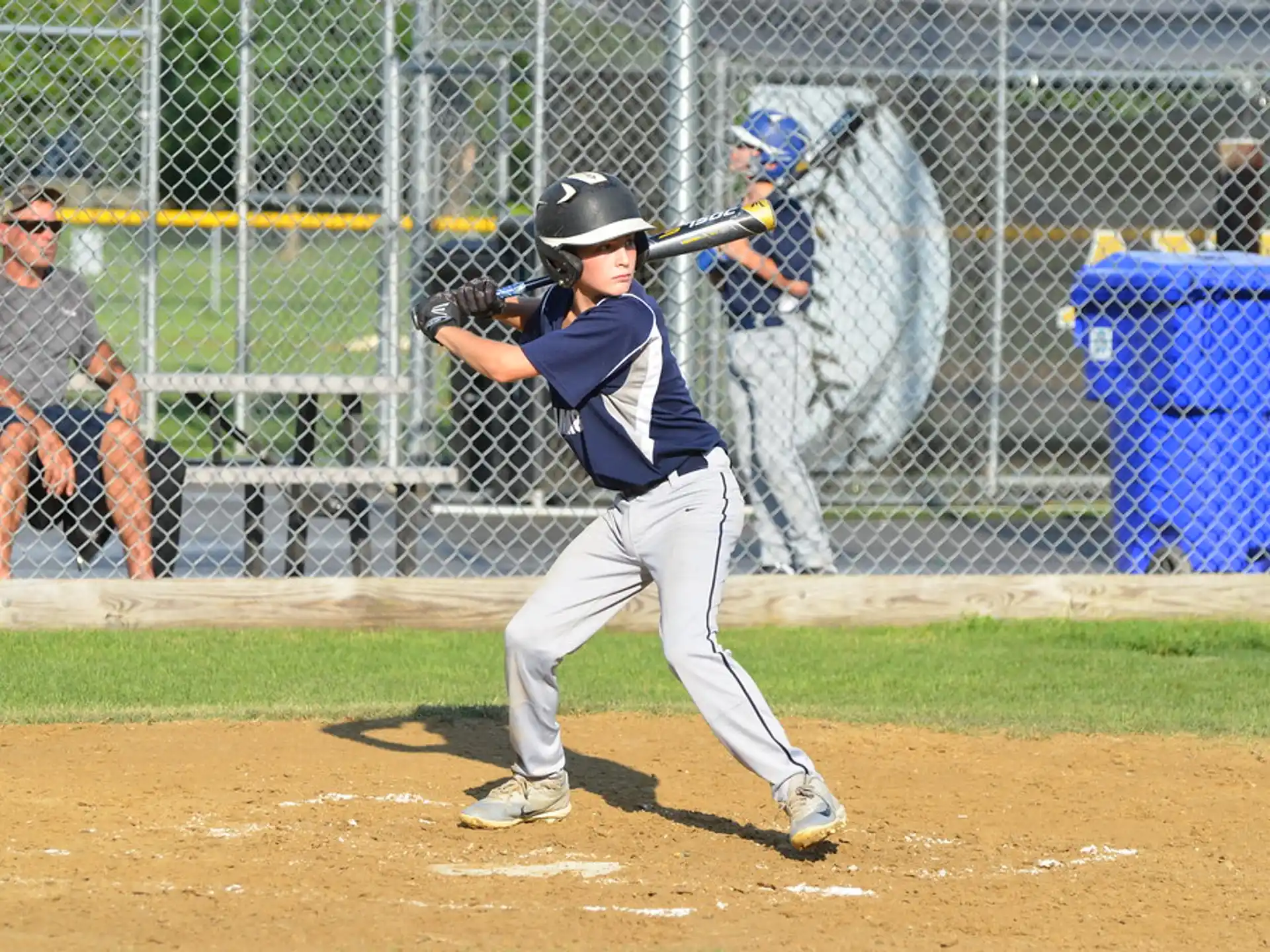 a kid swinging a baseball bat