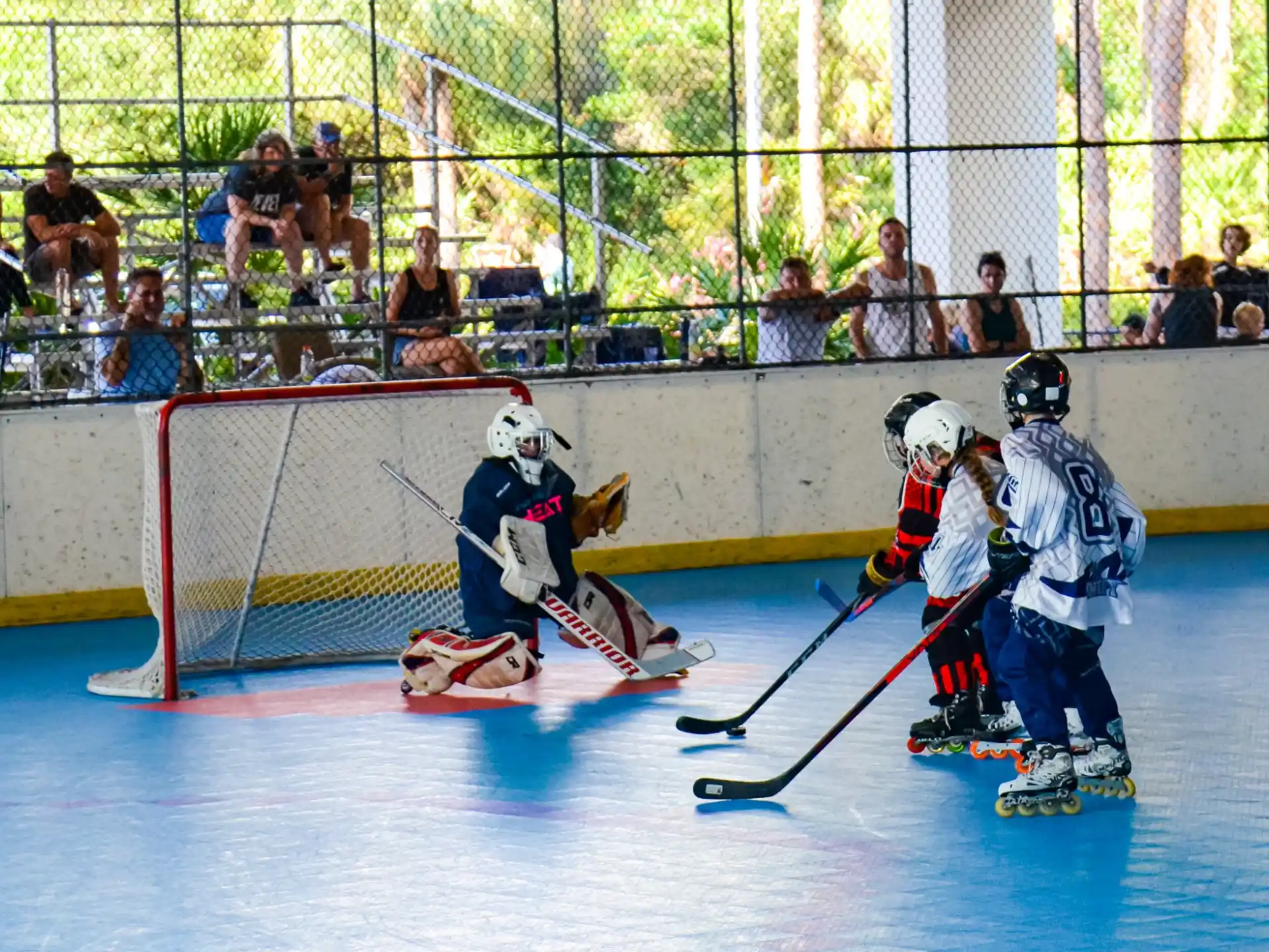 a group of people playing hockey