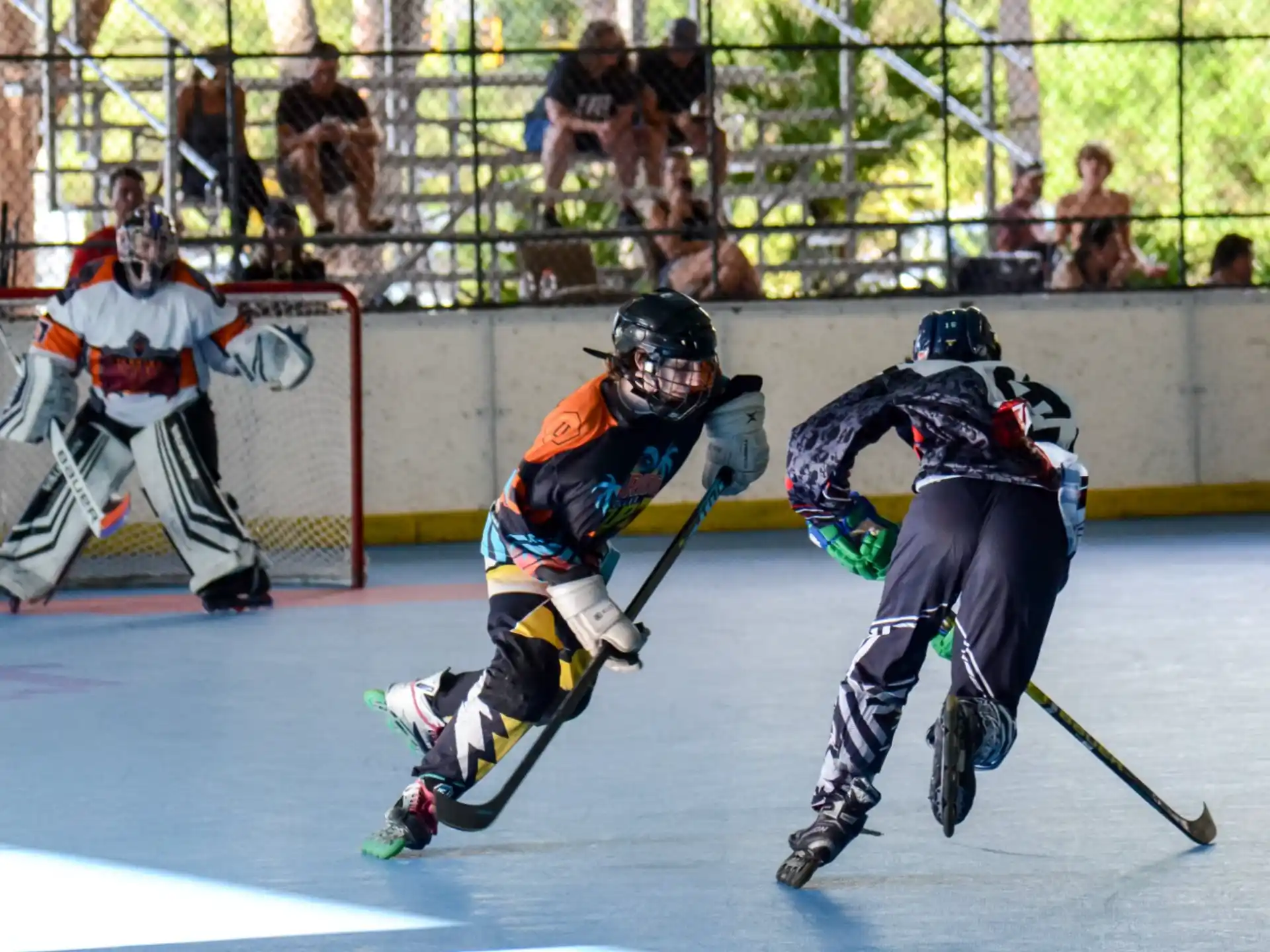 a group of people playing hockey