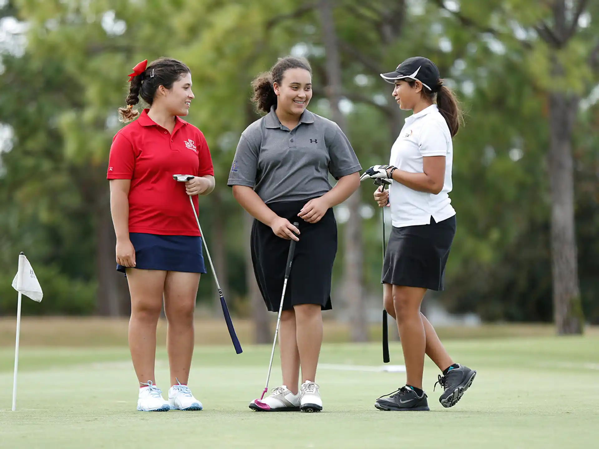 a group of people on a golf course
