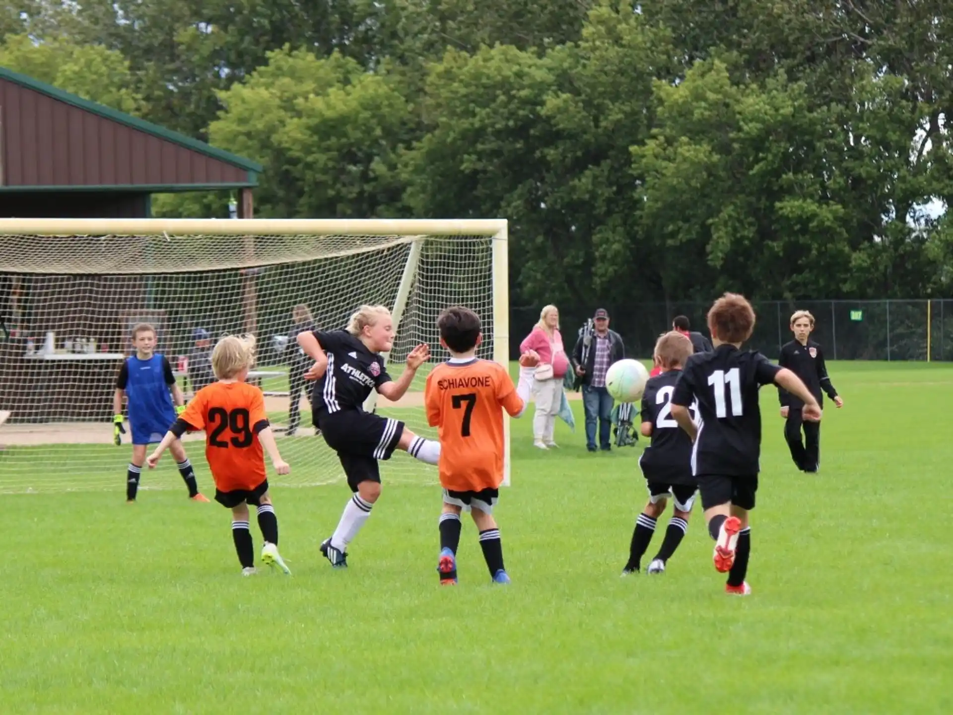 a group of kids playing football
