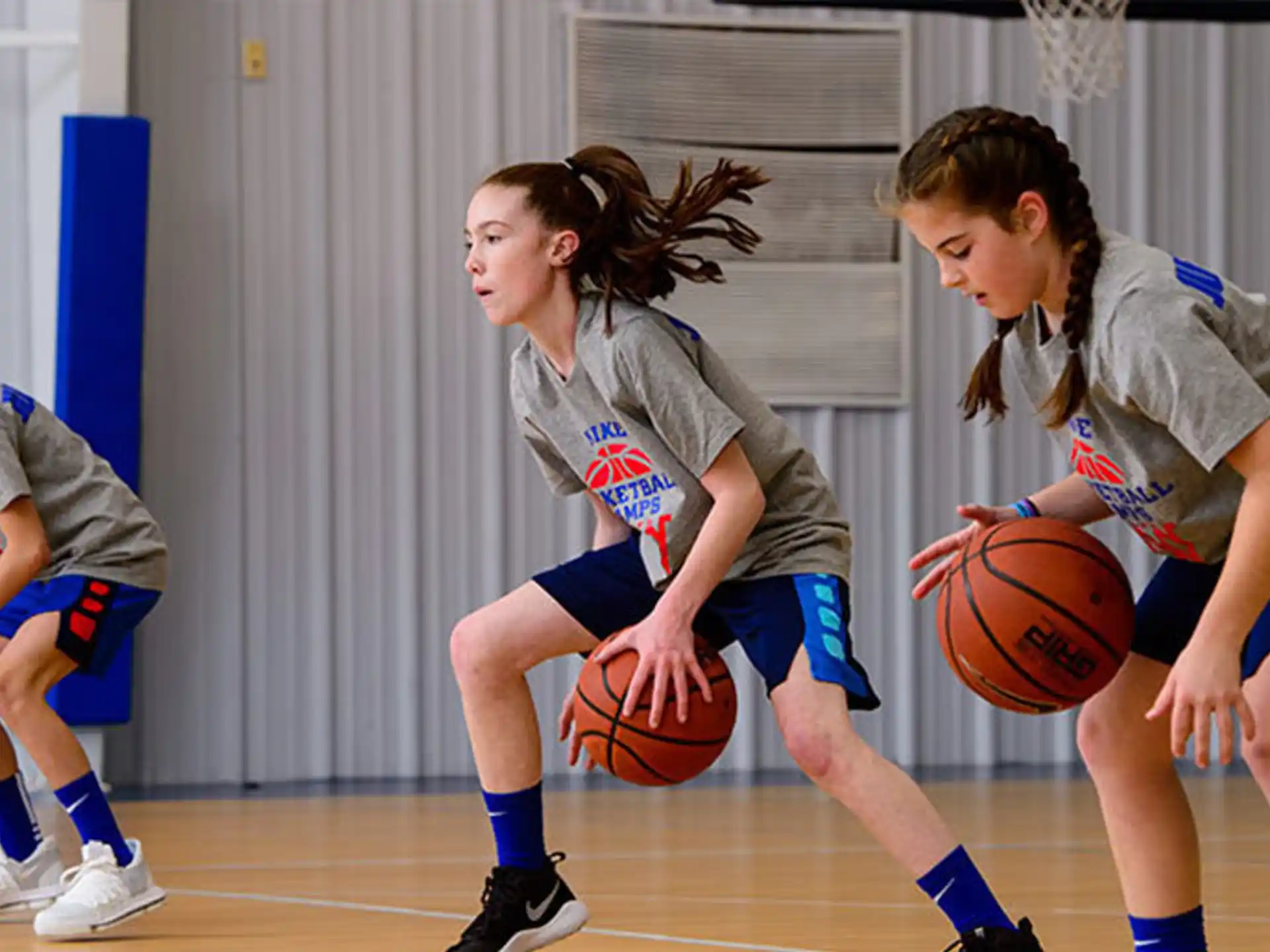 a group of women playing basketball