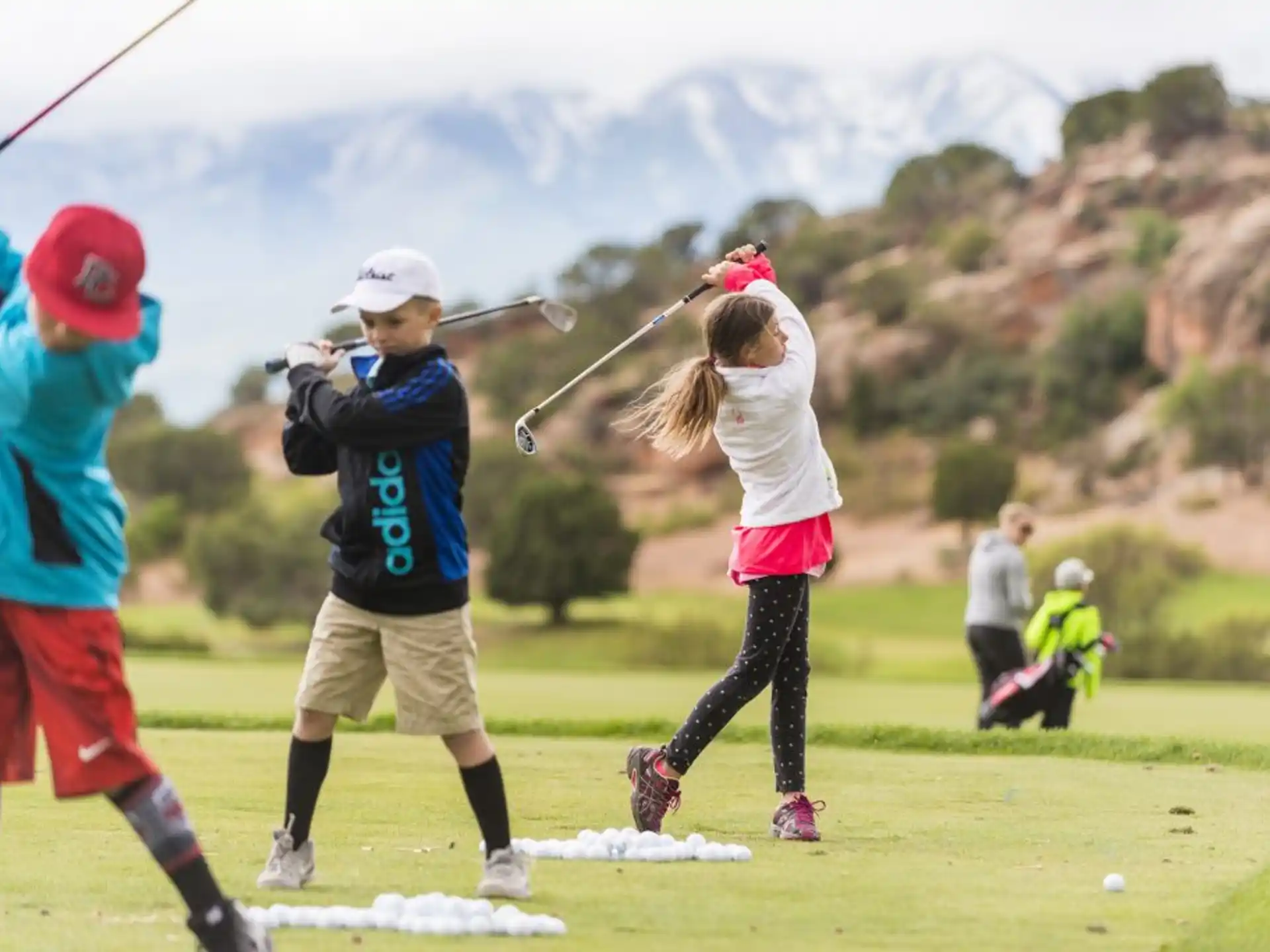 a group of people playing golf