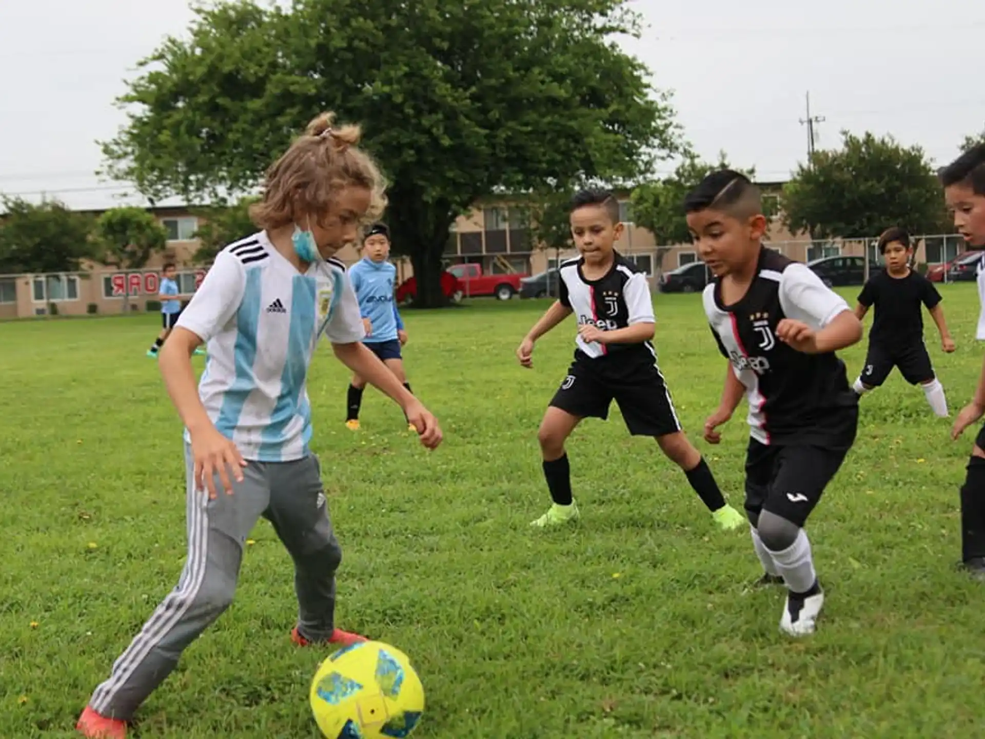 a group of kids playing football