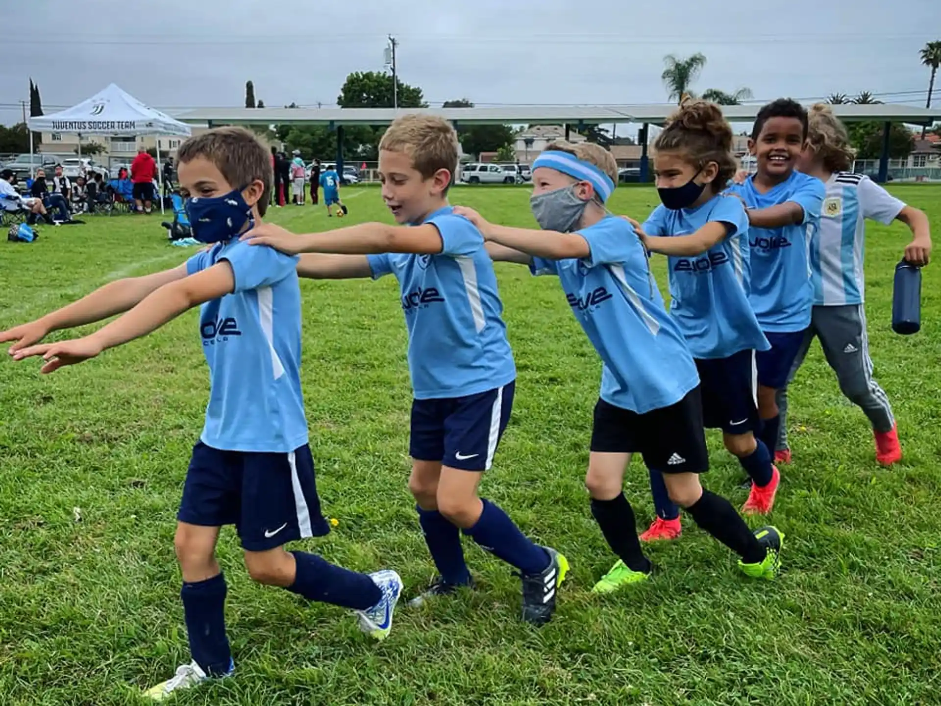a group of kids playing with a frisbee