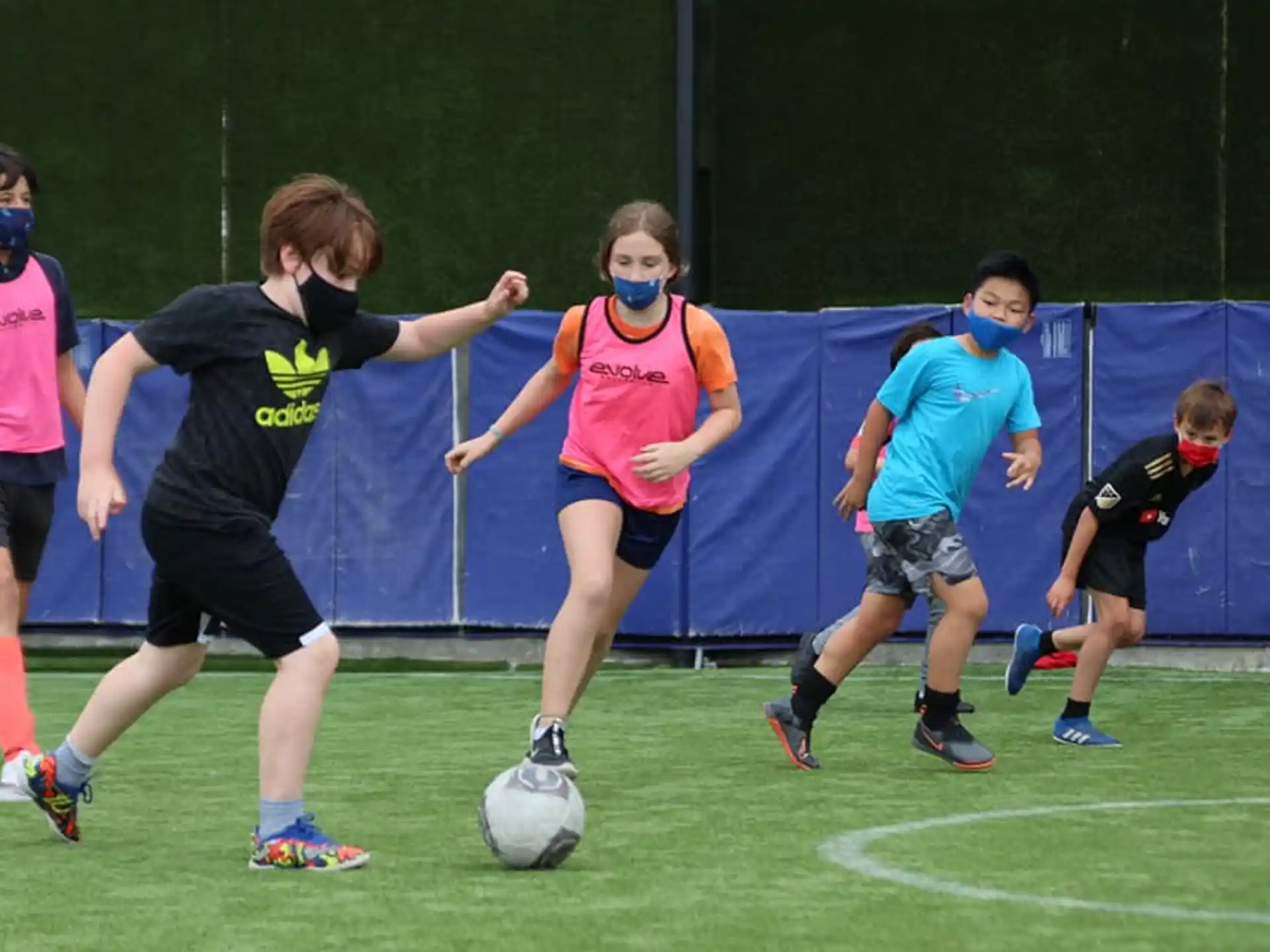 a group of people play football