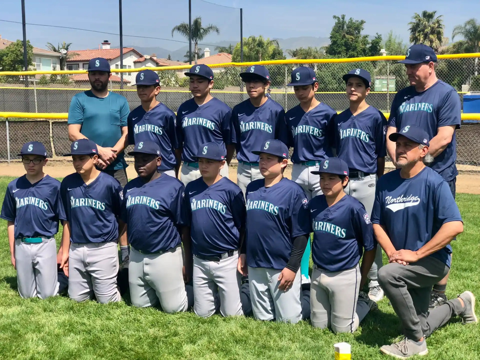 a group of baseball players posing for a photo