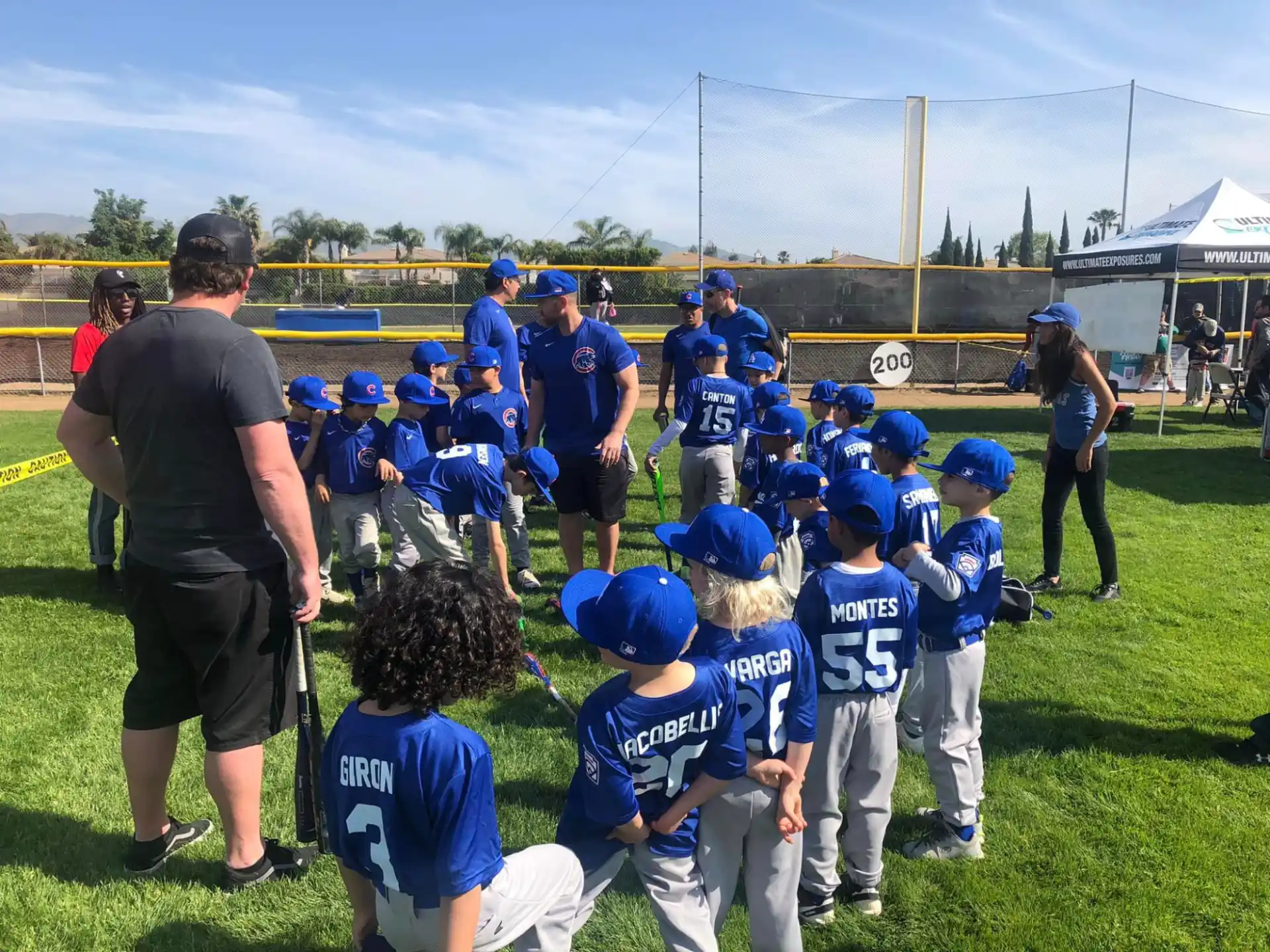 a group of kids in baseball uniforms