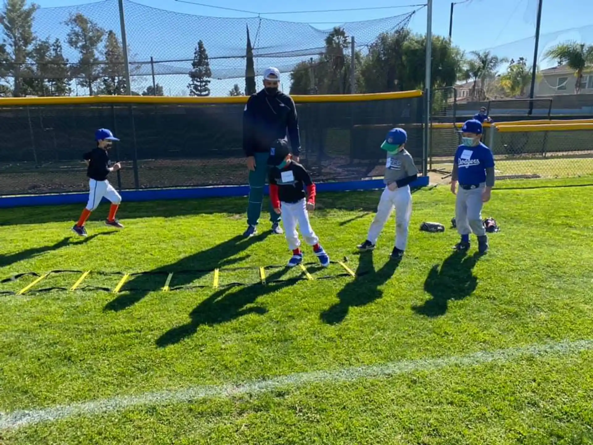 a group of kids playing baseball