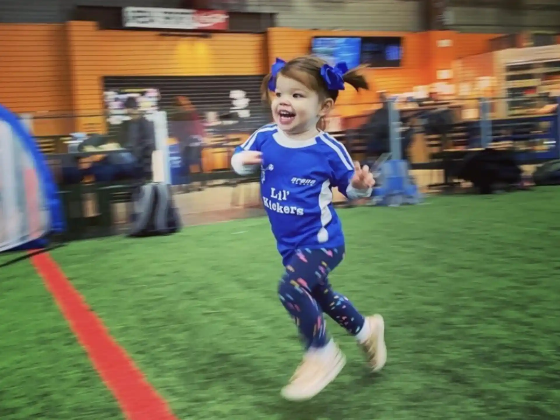 a girl running on a field