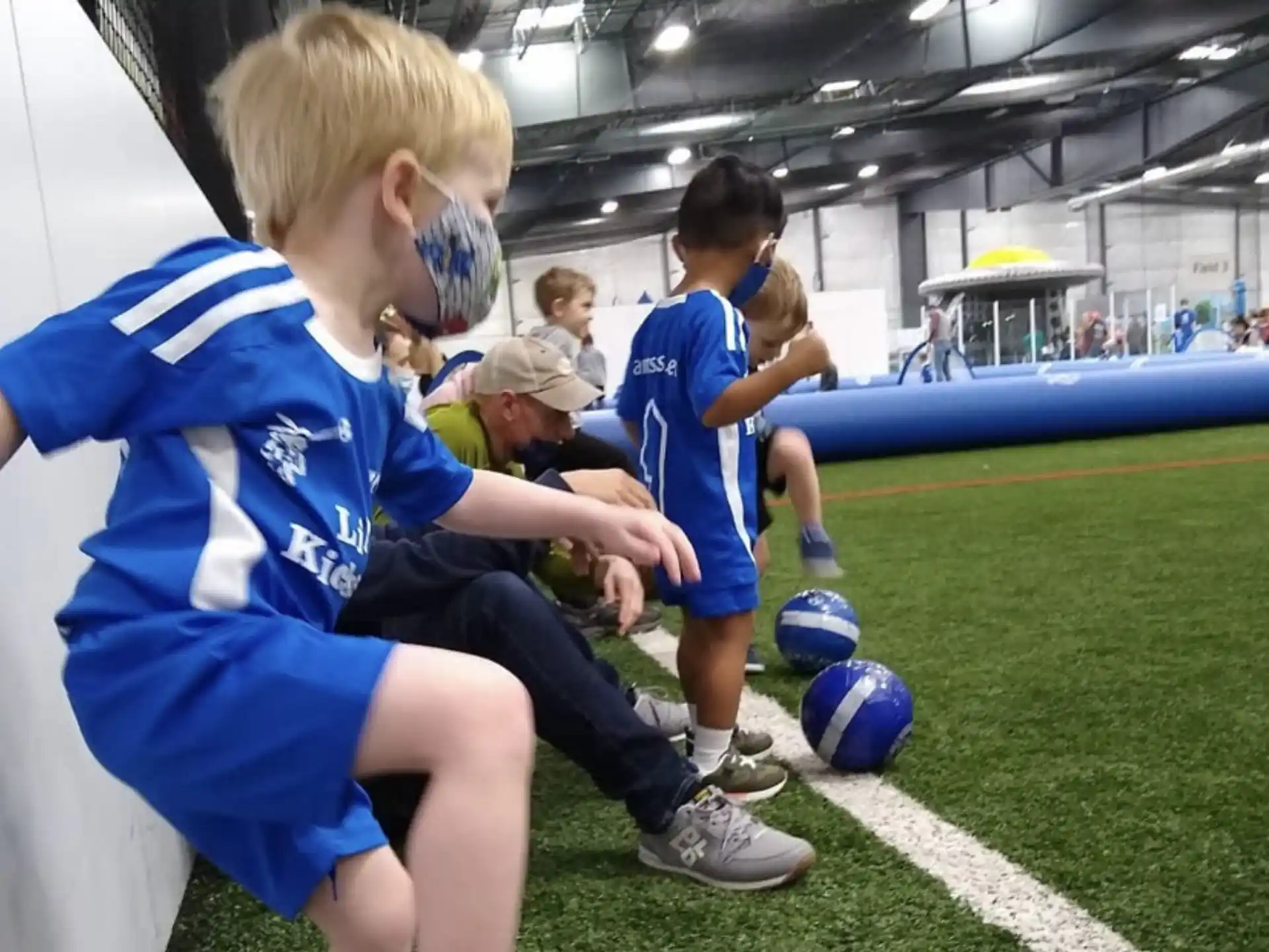a group of kids playing football
