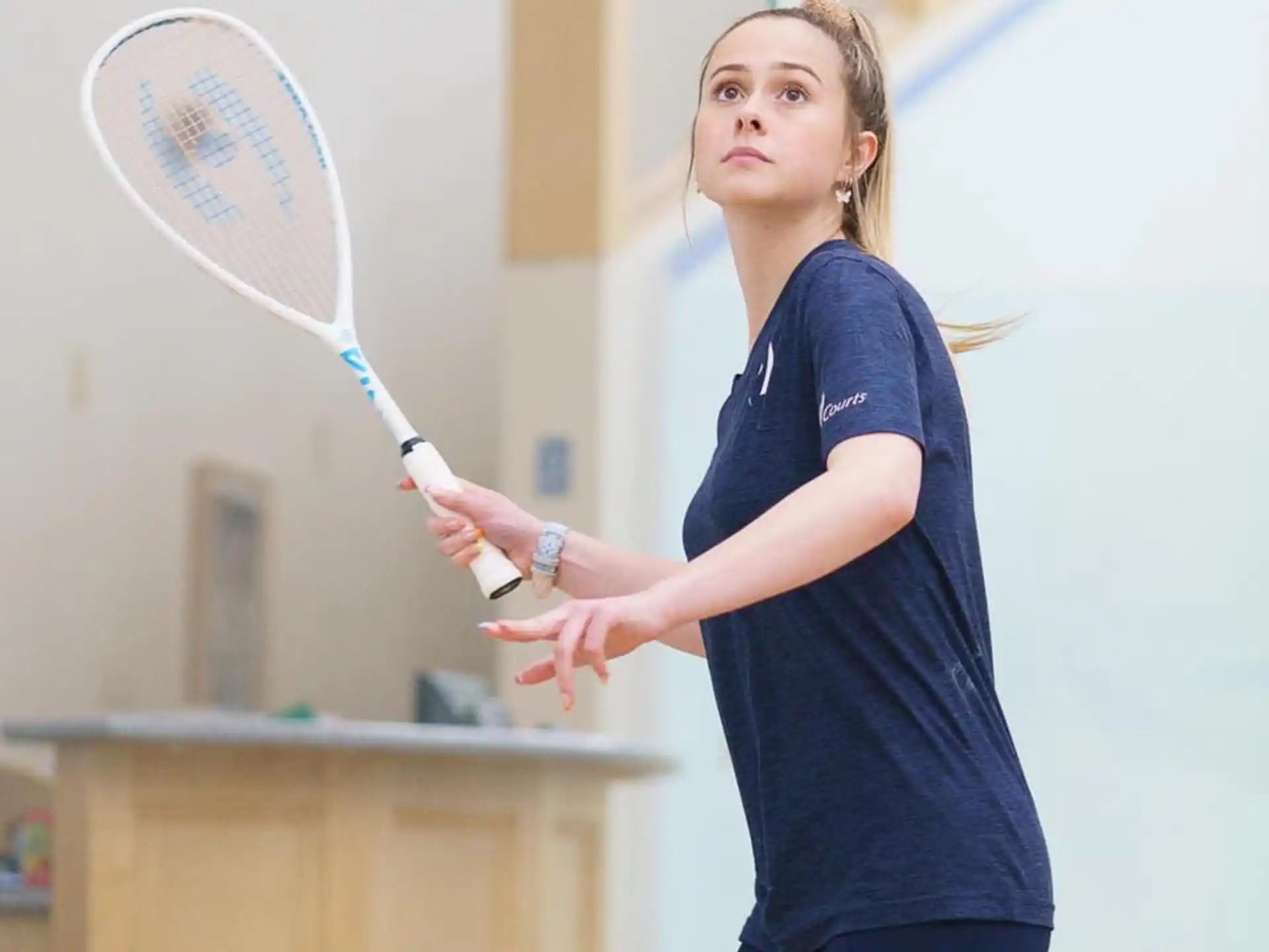 a person holding a tennis racket