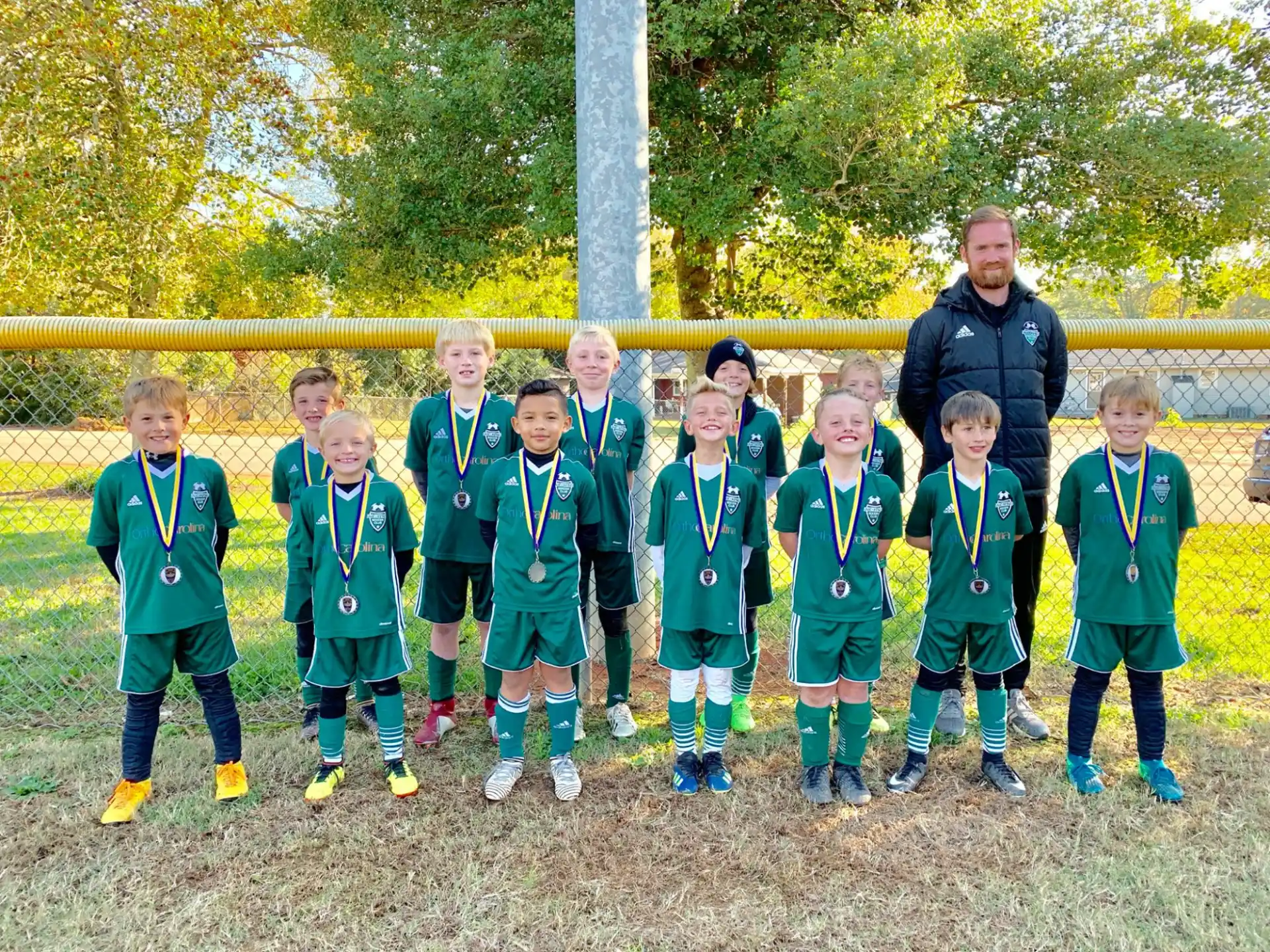 a group of boys wearing medals