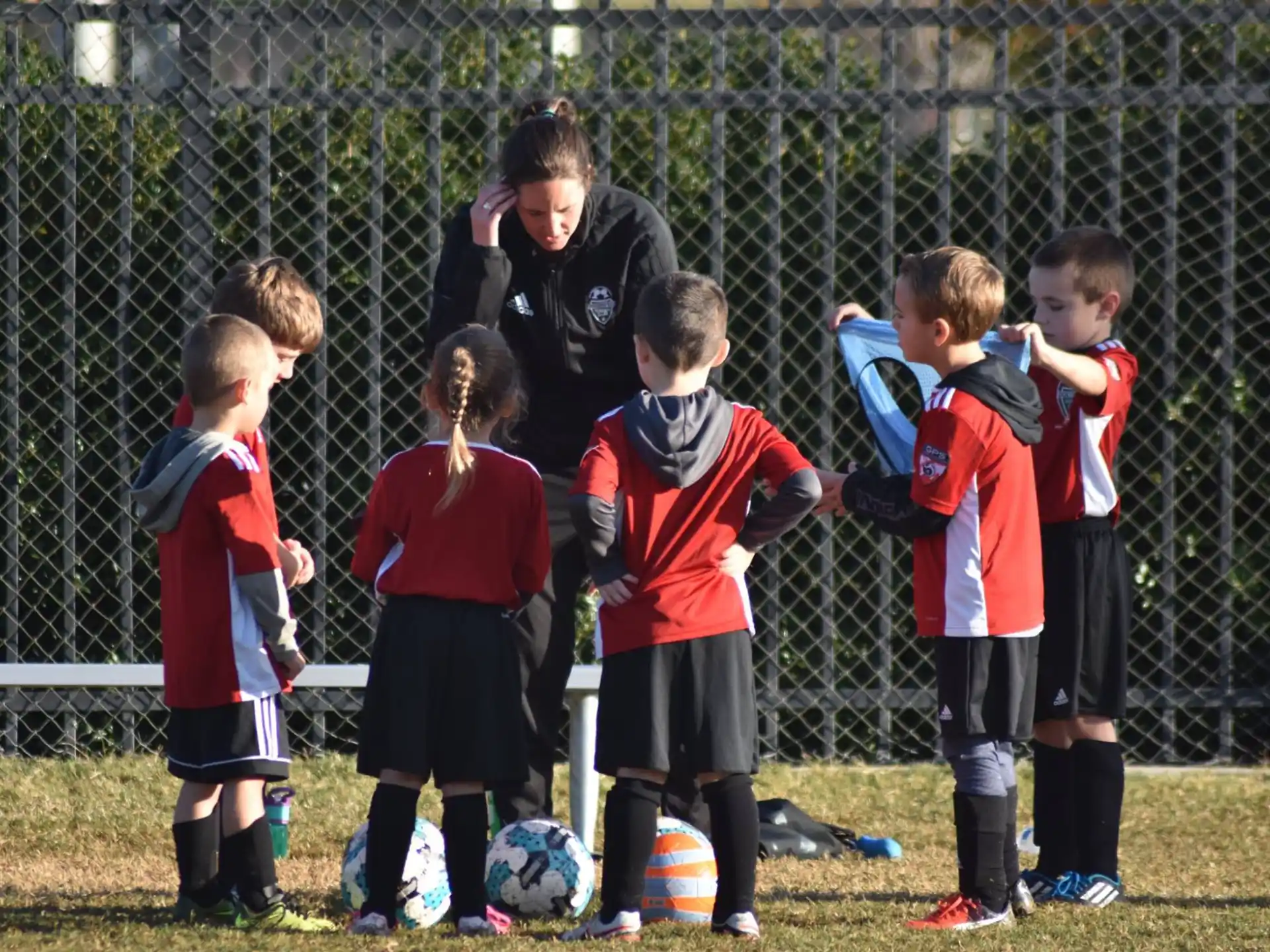 a group of kids playing football