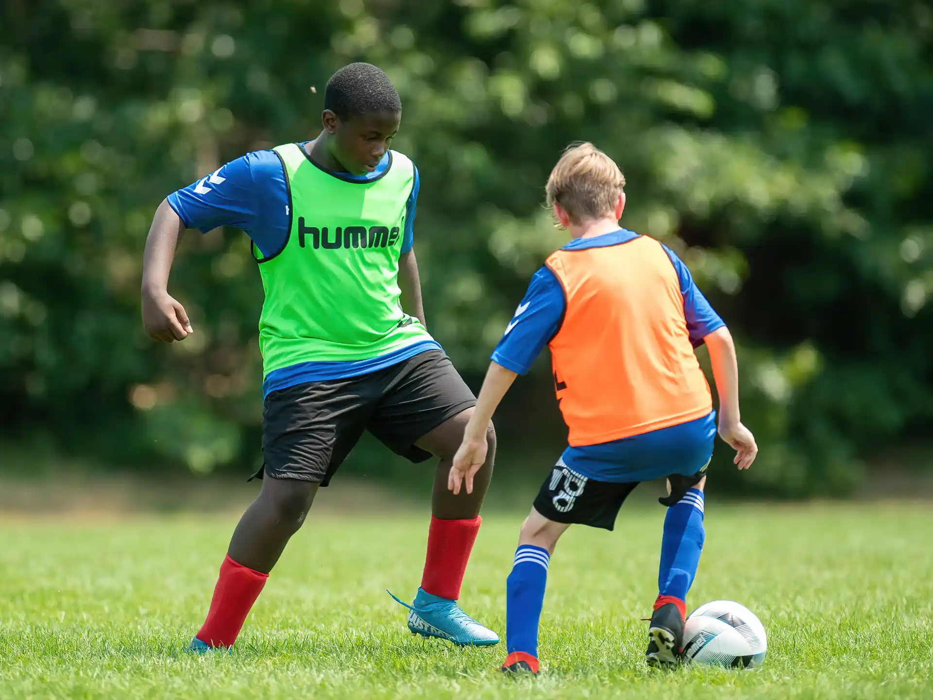 a couple of boys playing football
