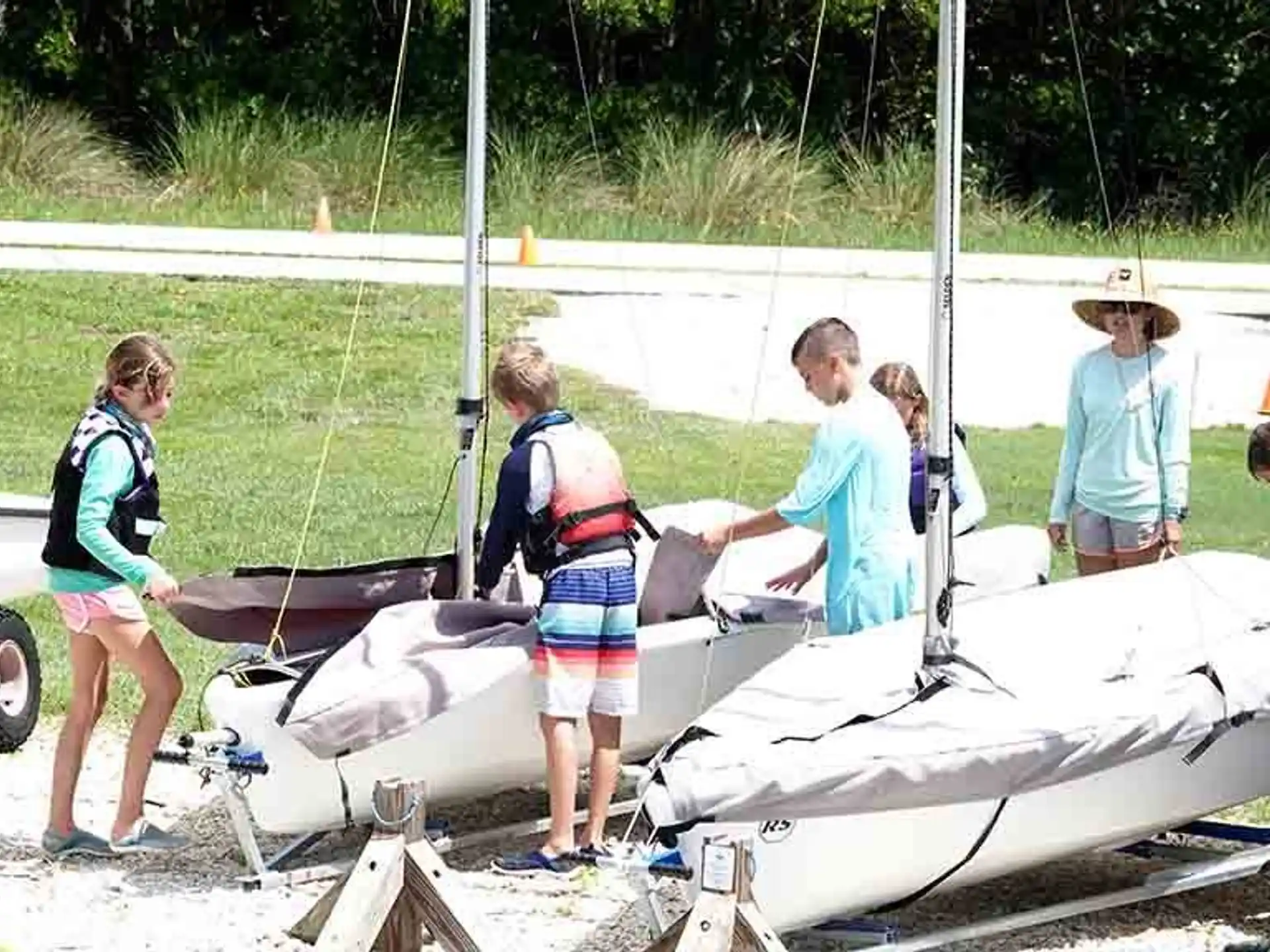 people standing around a crashed airplane