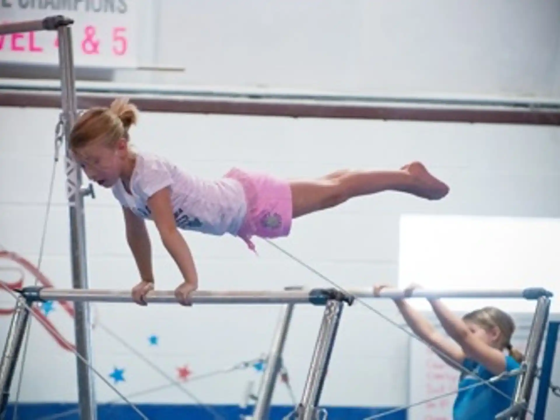 a person jumping over a bar