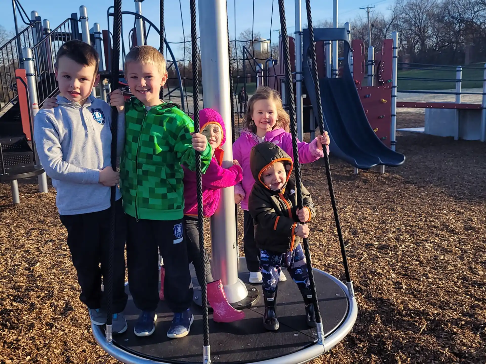 a group of children on a swing