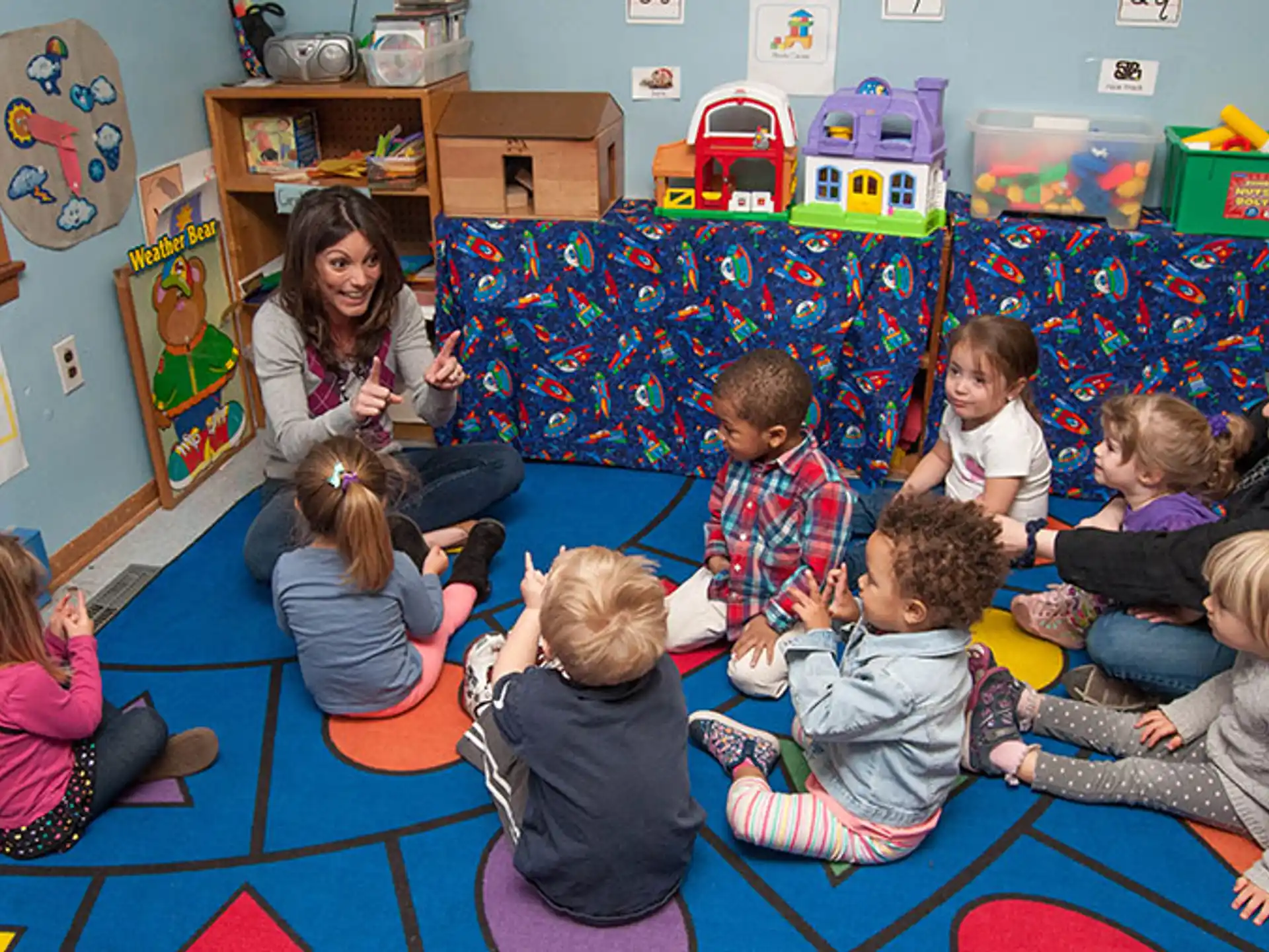 a group of children sitting on the floor