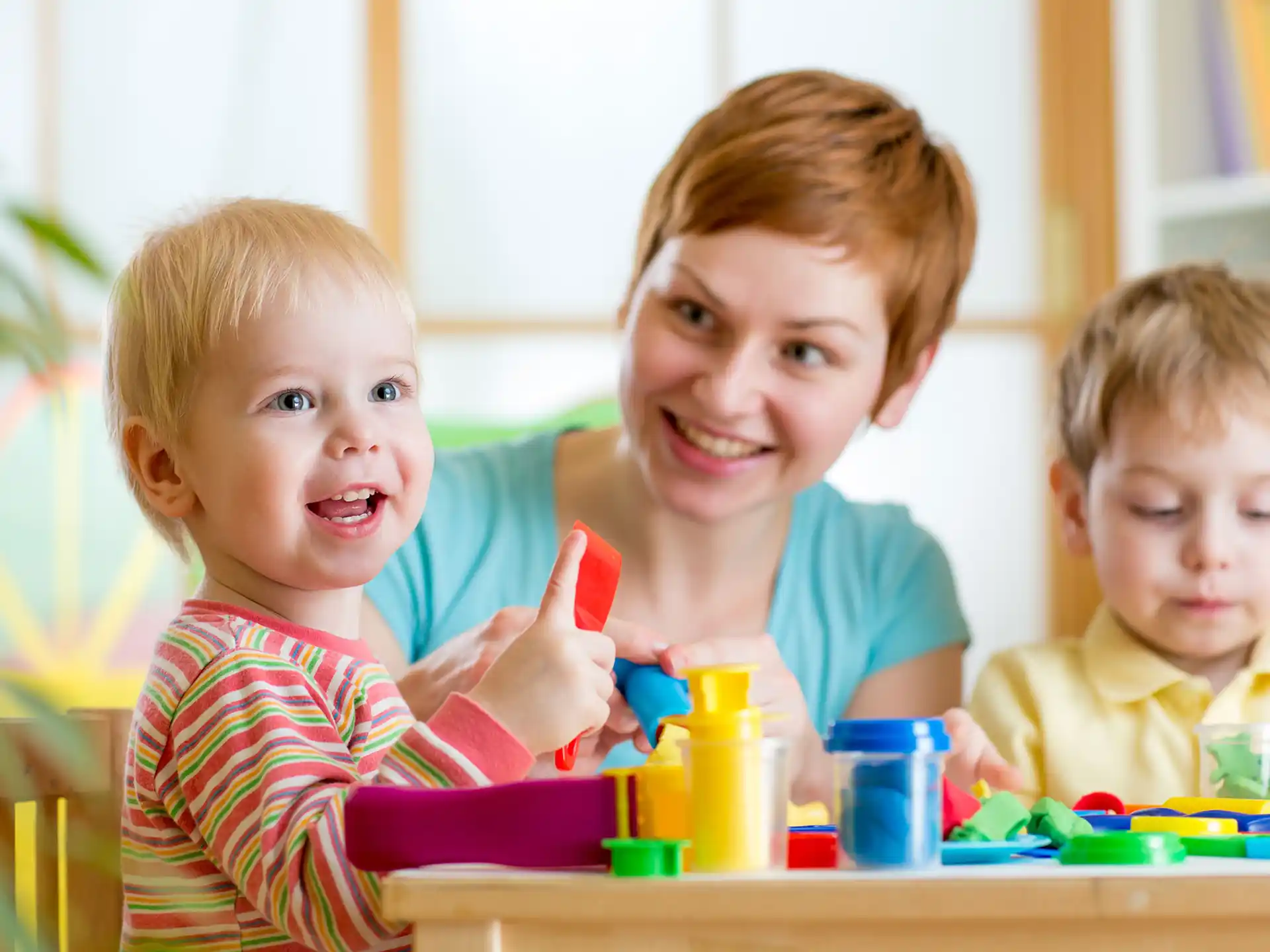 a group of kids playing with toys