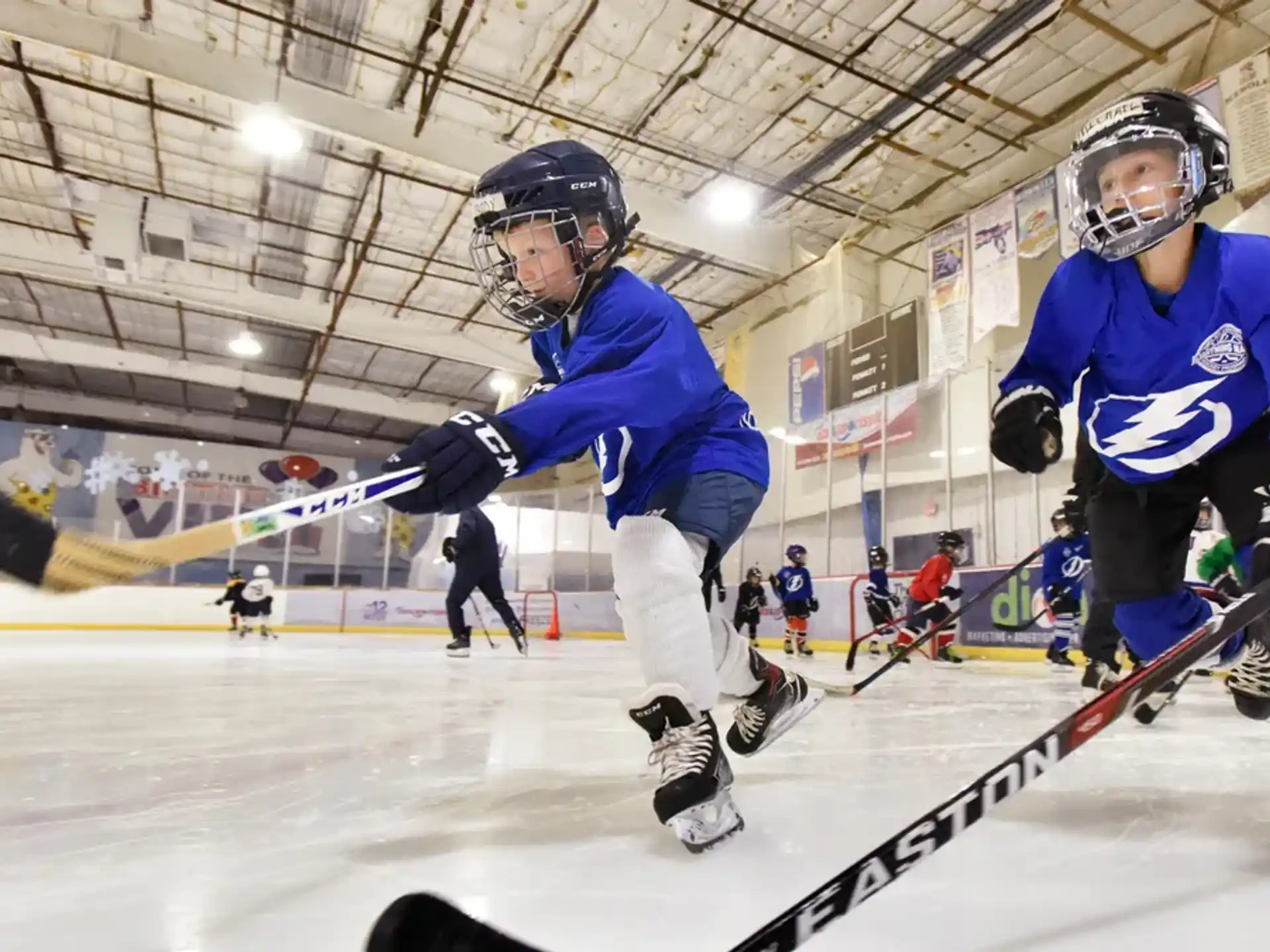 a couple of men playing hockey