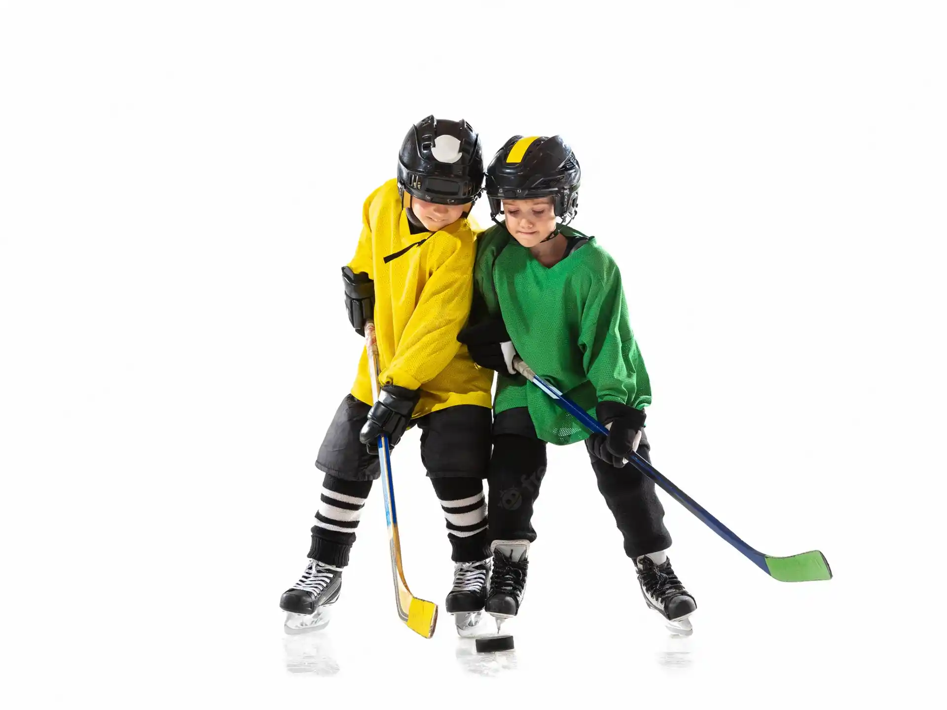 a couple of people playing hockey