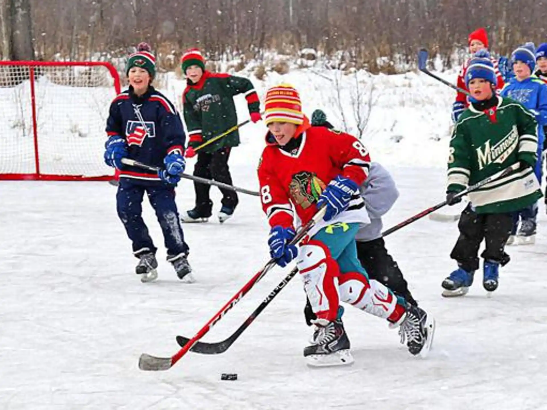 a group of people playing hockey