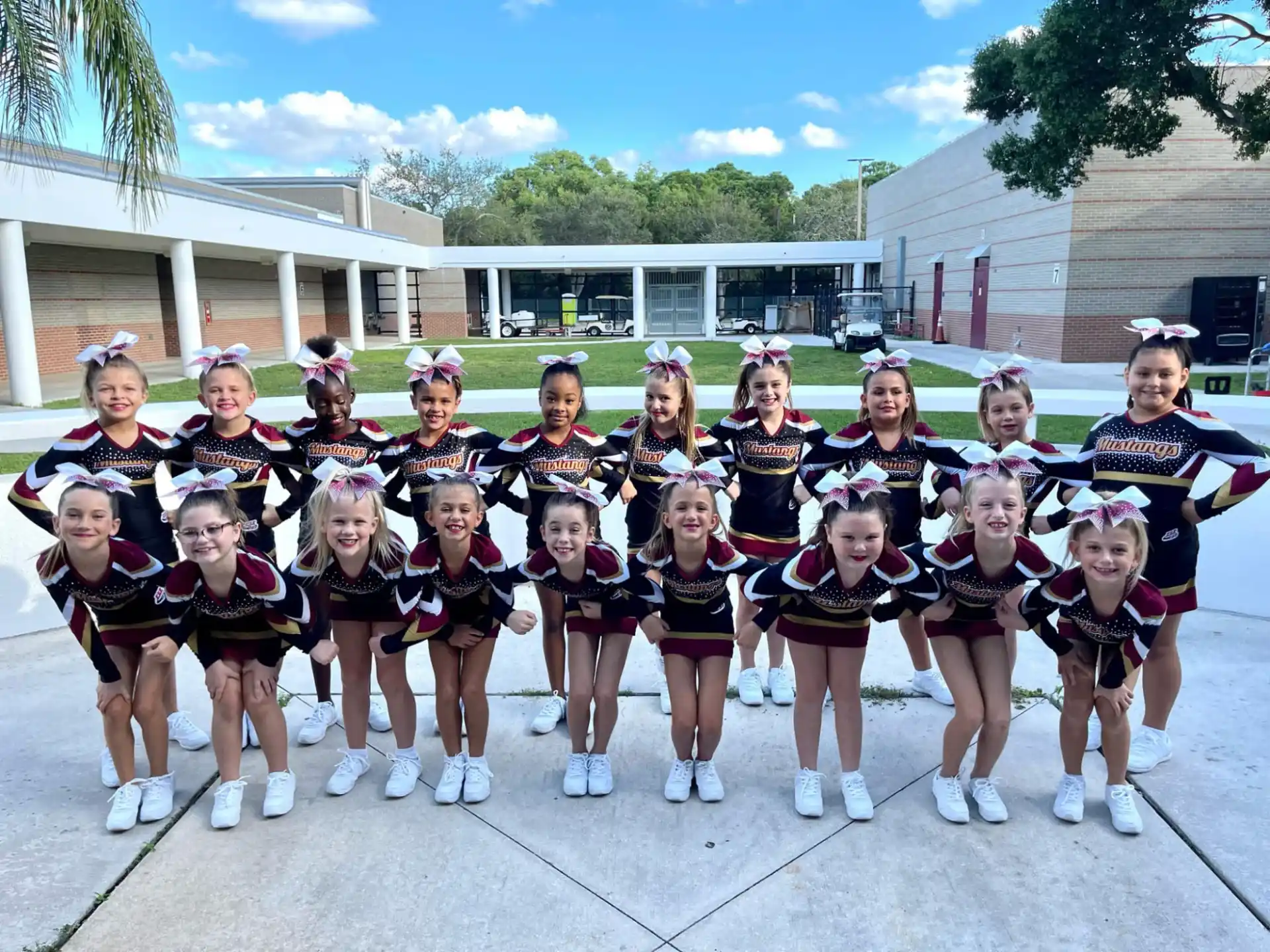 a group of girls in matching outfits