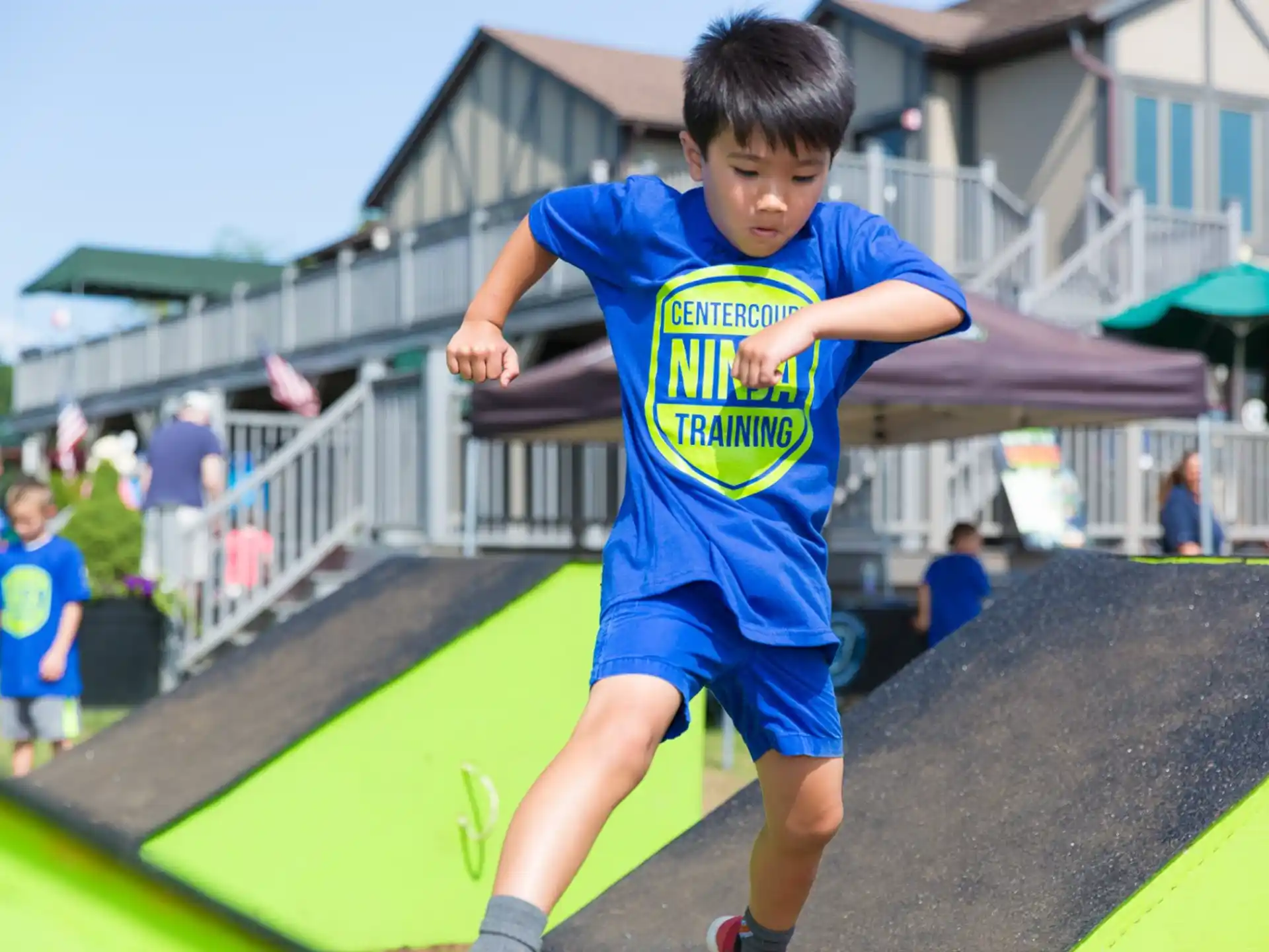 a boy running on a trampoline