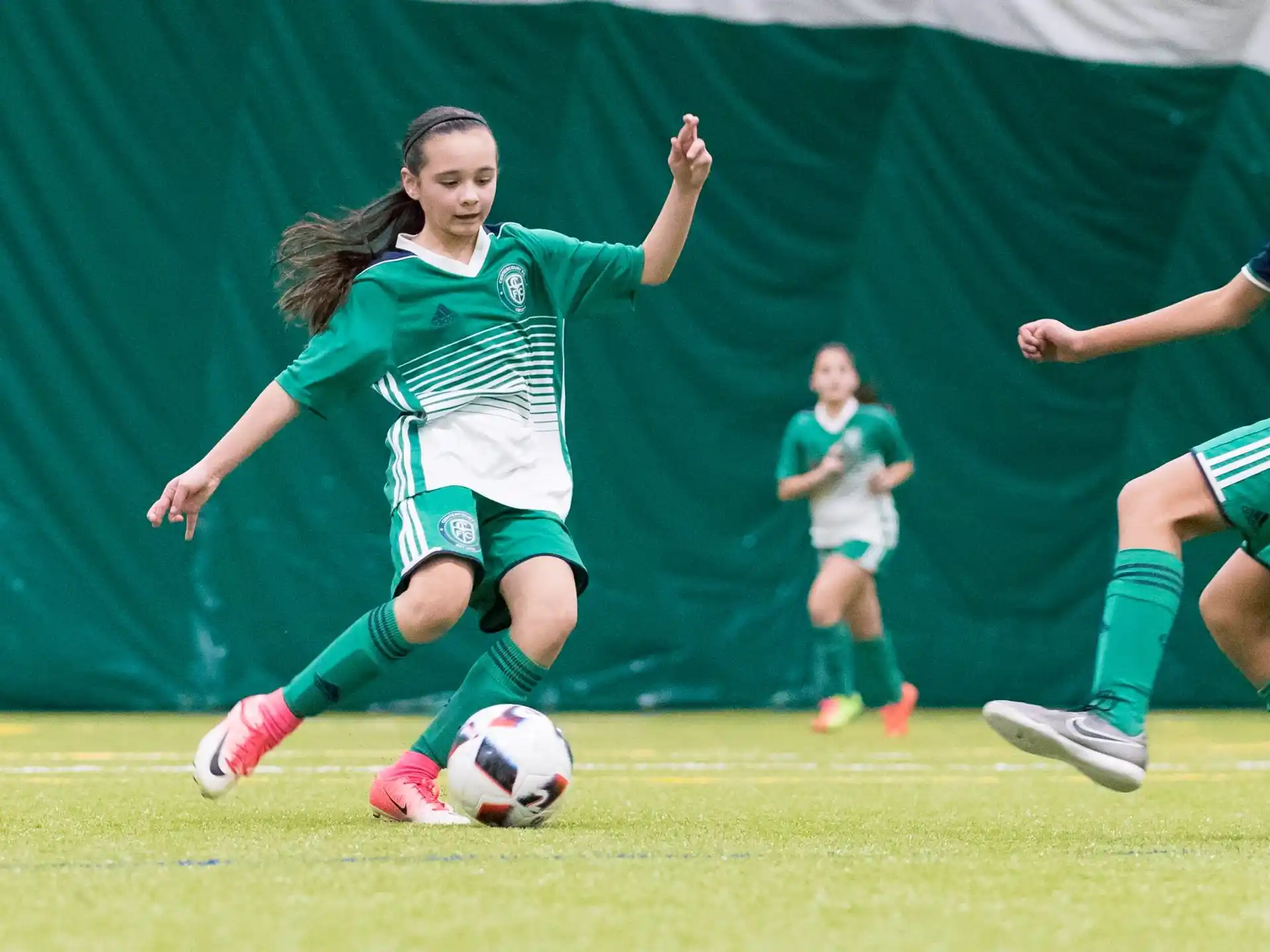 a group of girls playing football