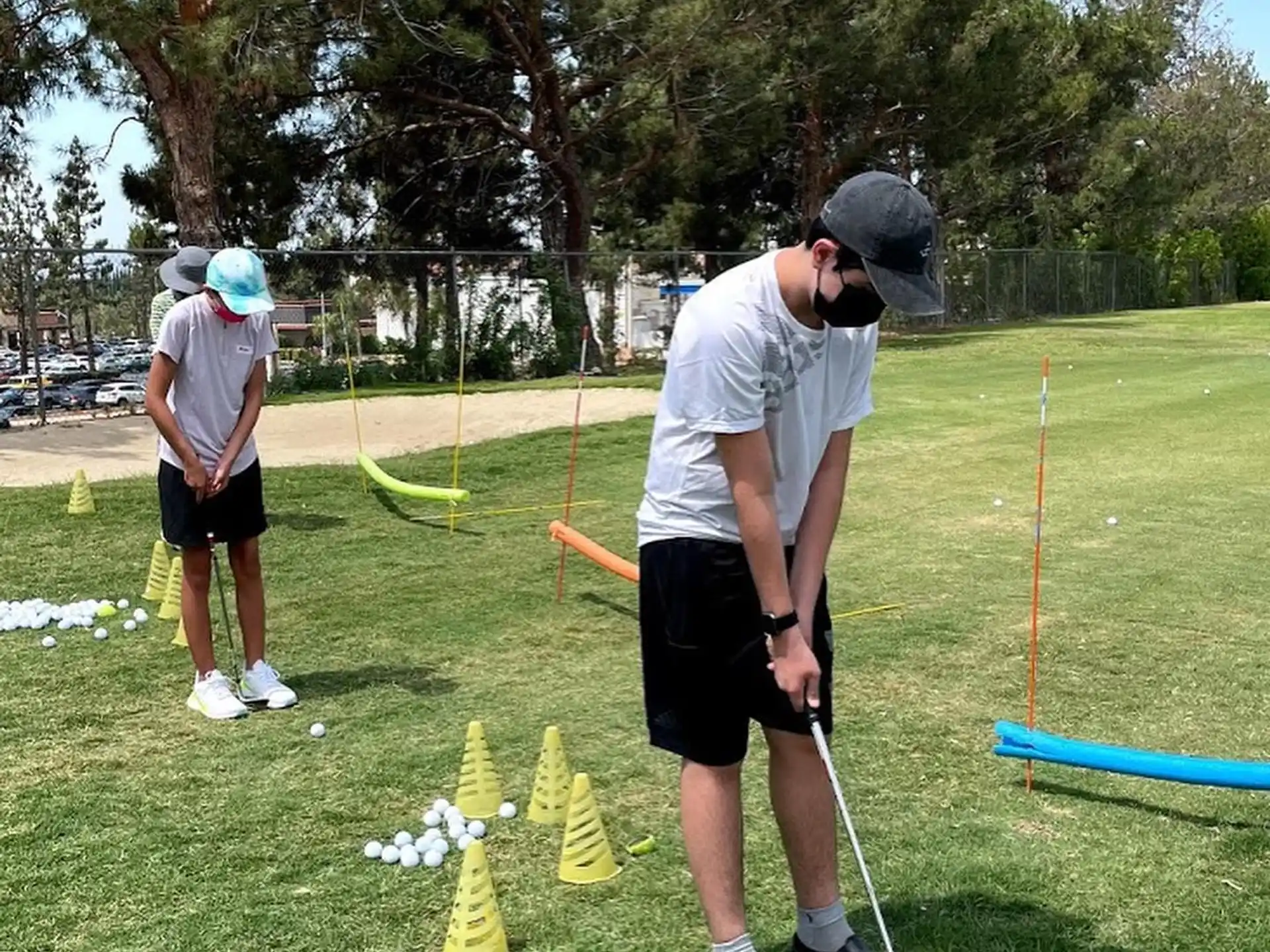 a group of people playing golf