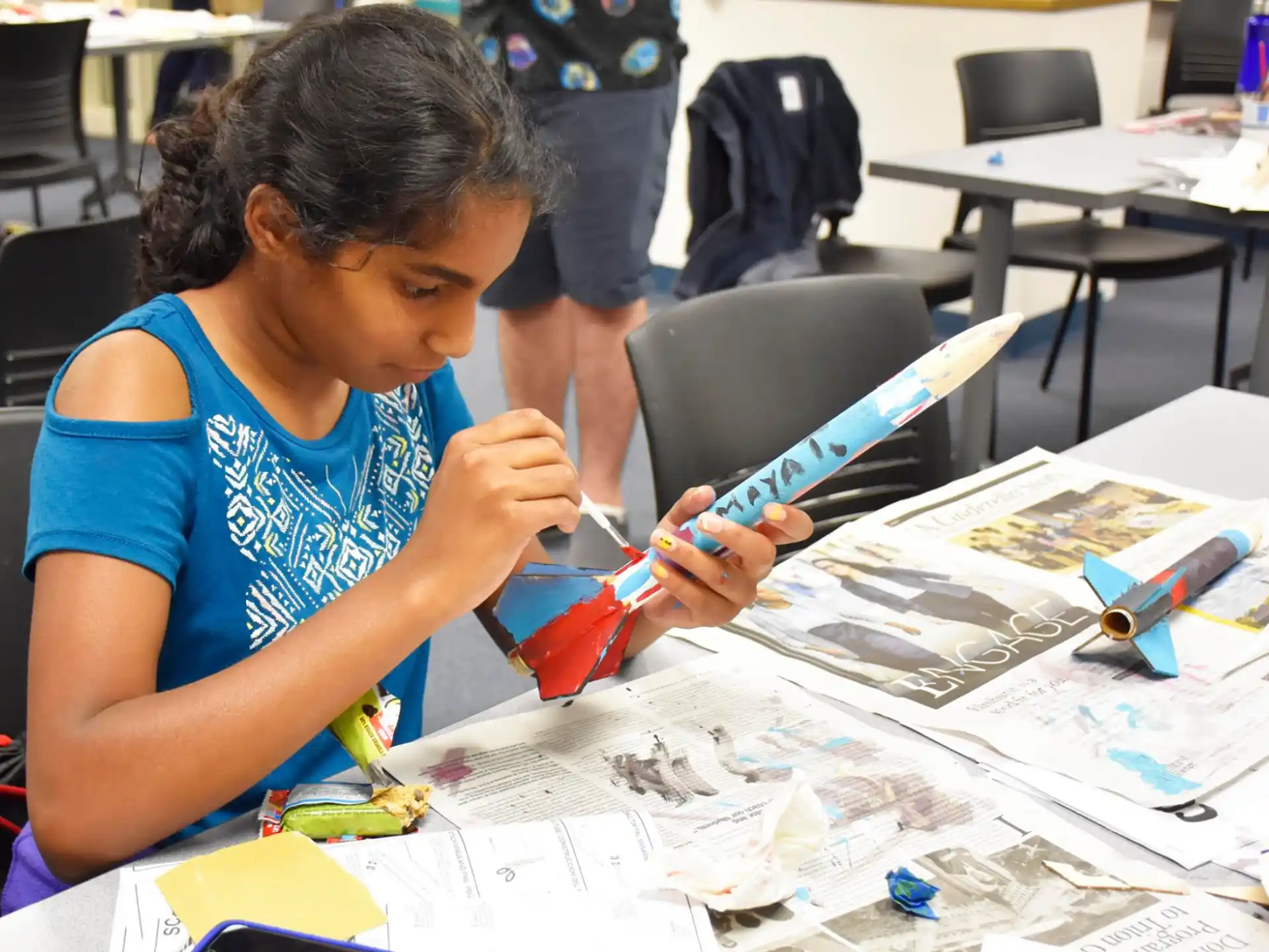a young girl painting