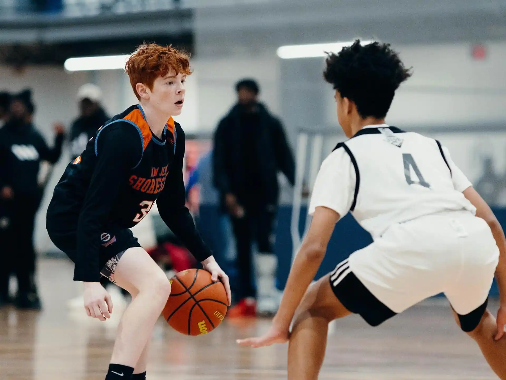 a couple of men playing basketball