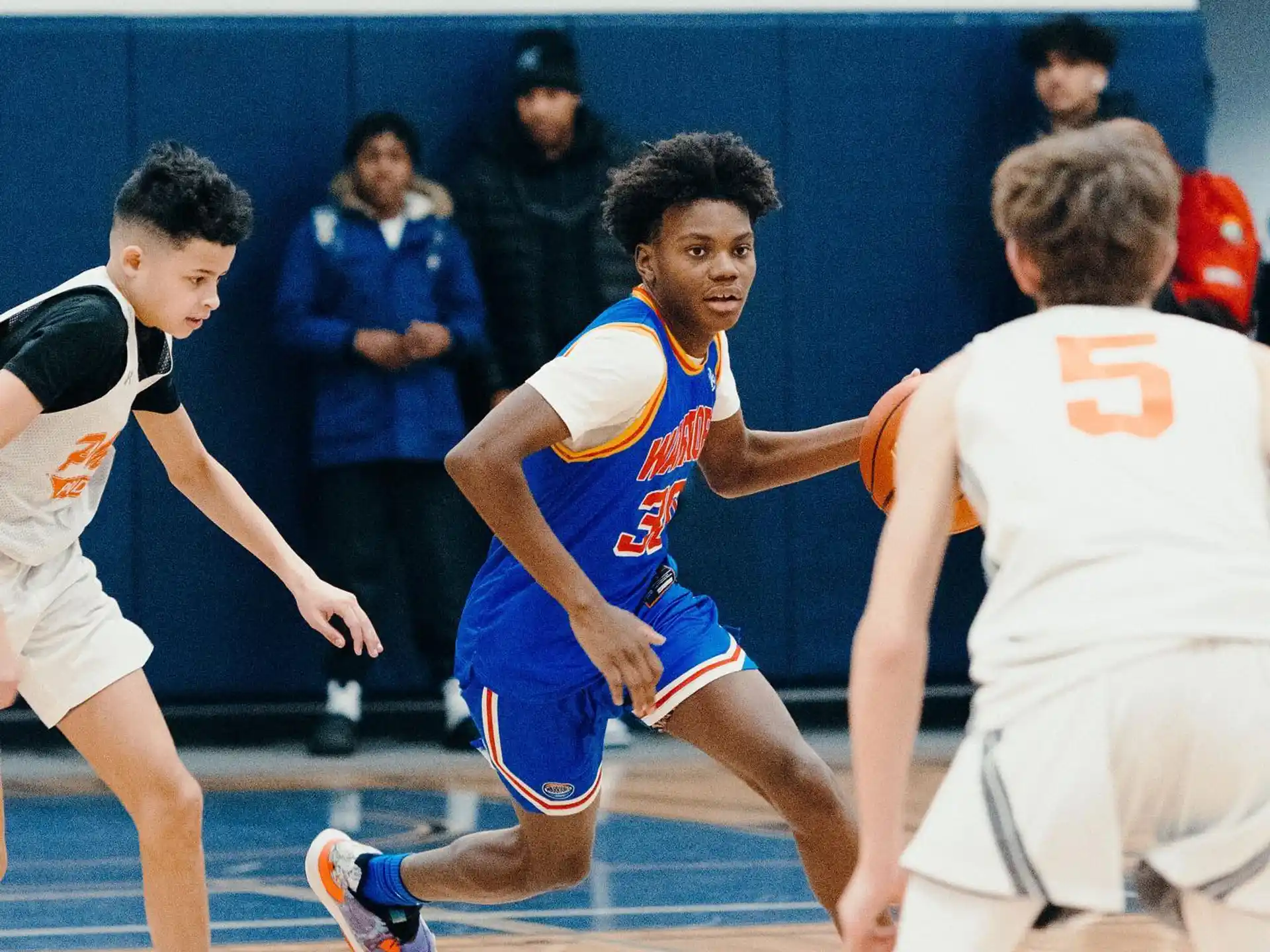 a group of people playing basketball