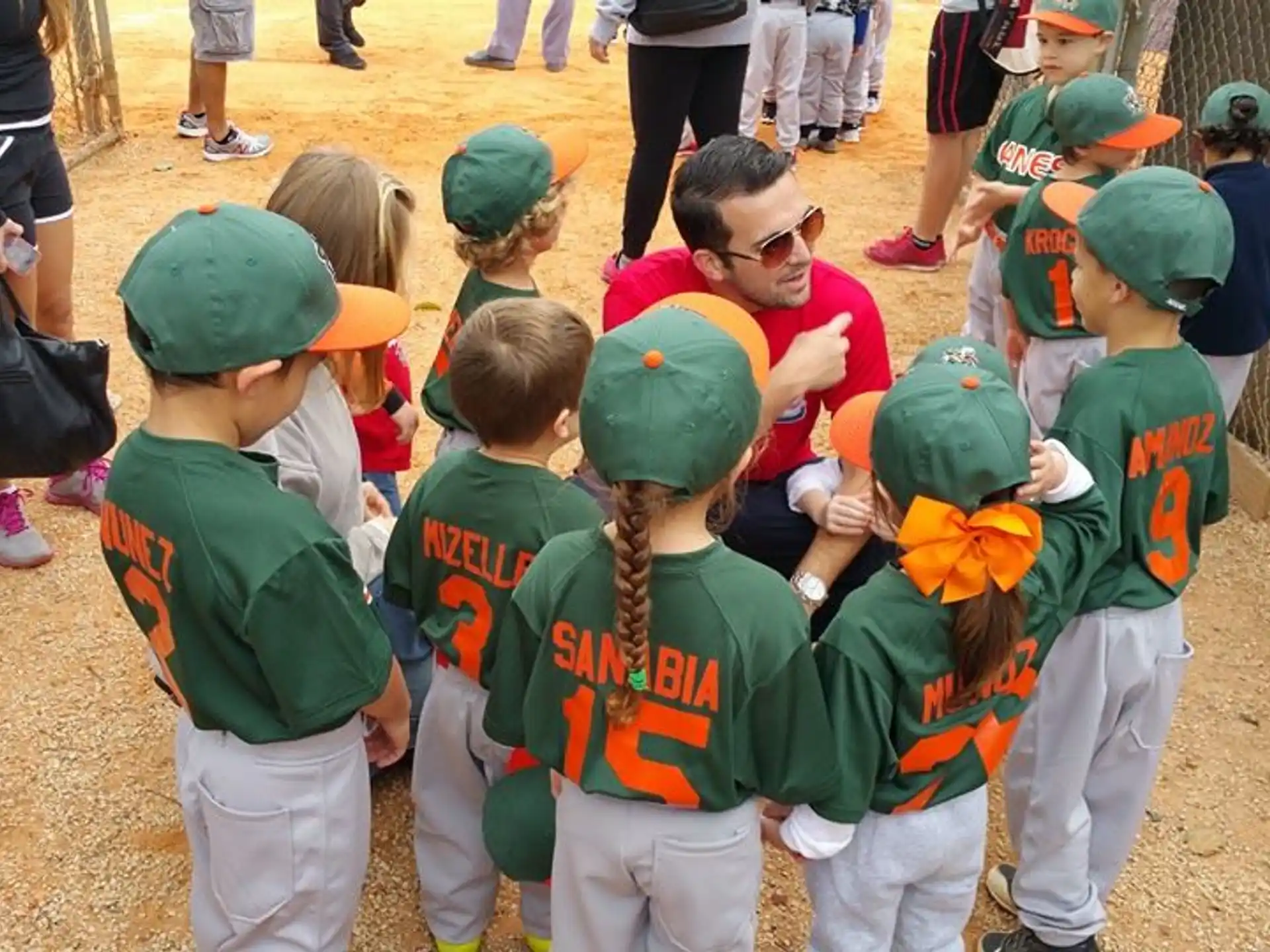 a group of kids wearing green and red clothing