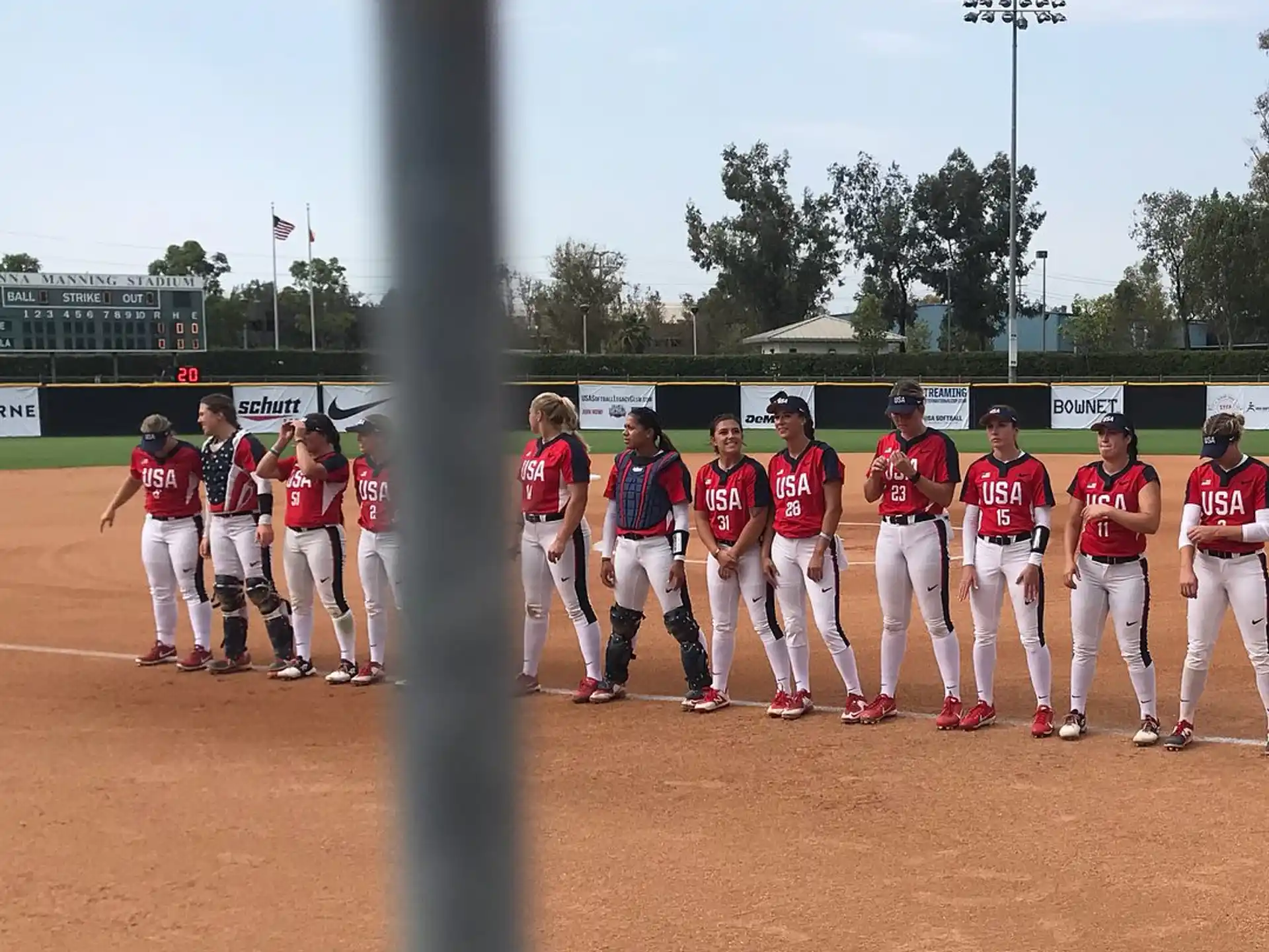 a group of baseball players standing on a field
