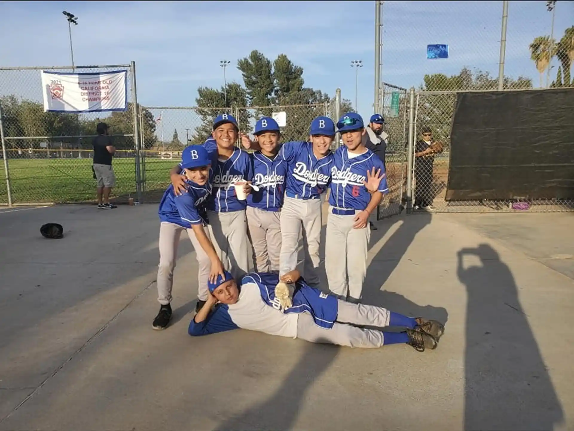 a group of kids wearing blue uniforms