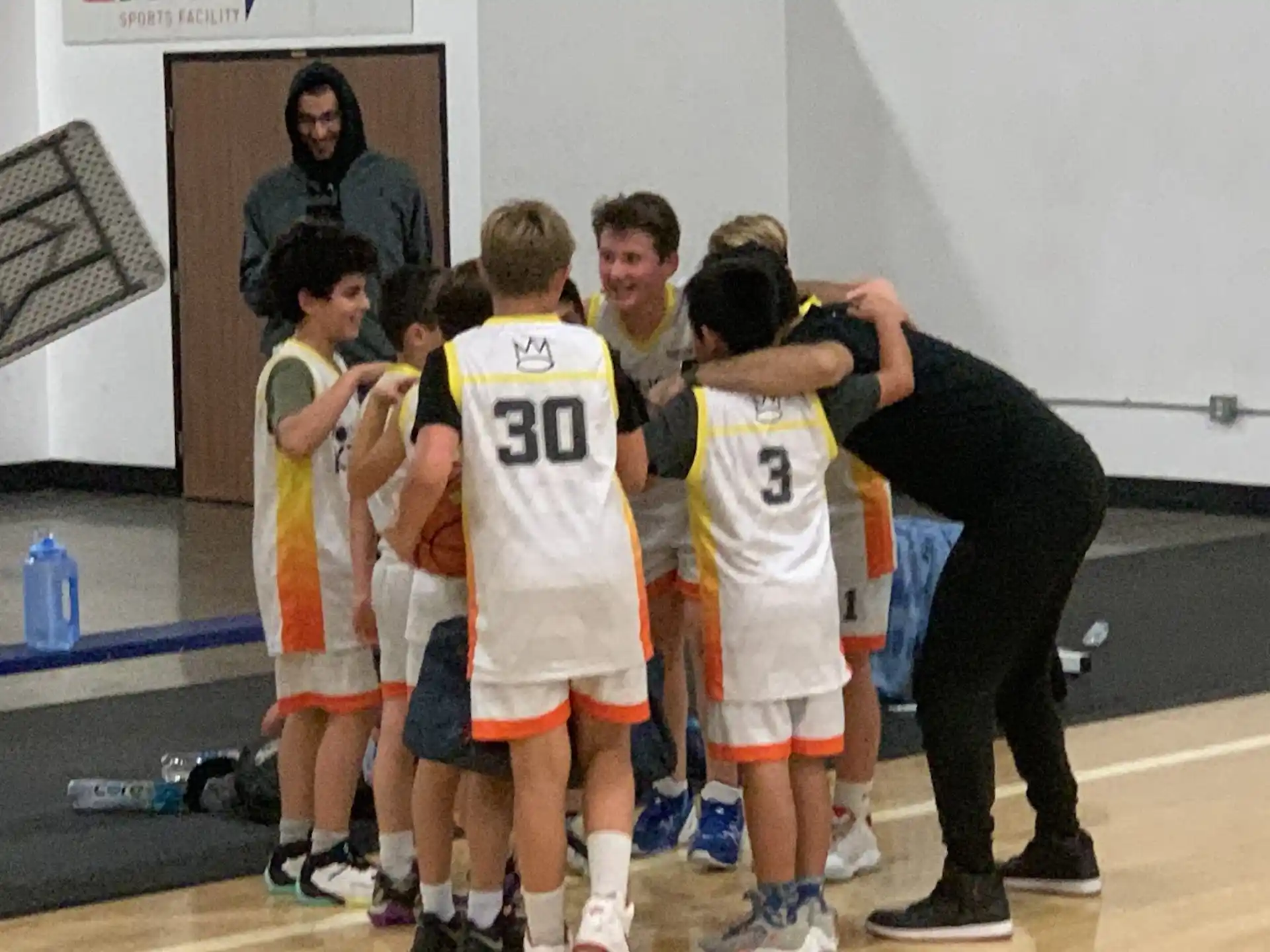 a group of boys in basketball uniforms
