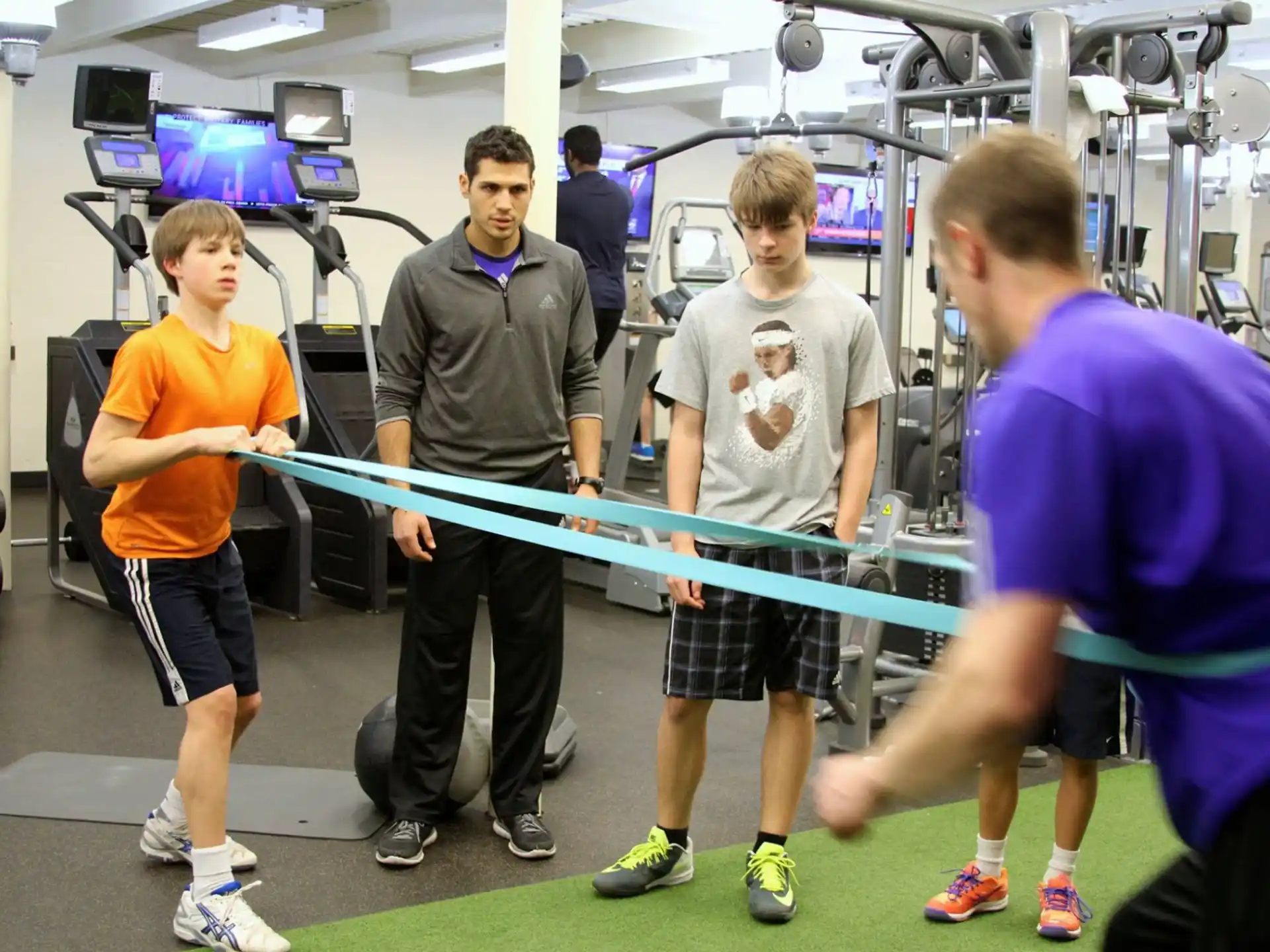 a group of people in a gym
